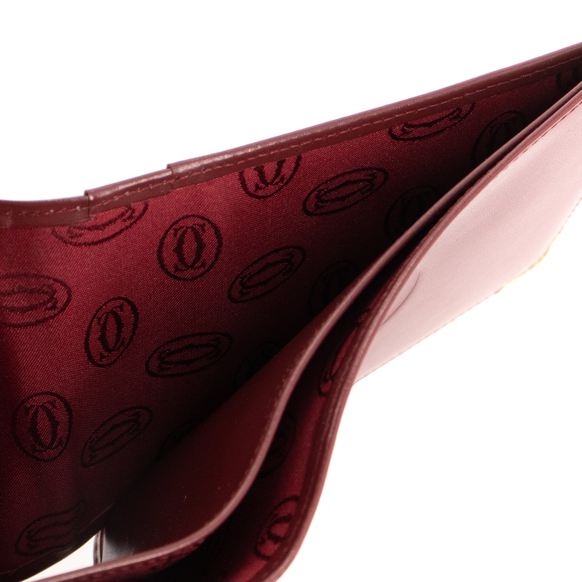 CARTIER - Portefeuille Compact Cartier en cuir bordeaux