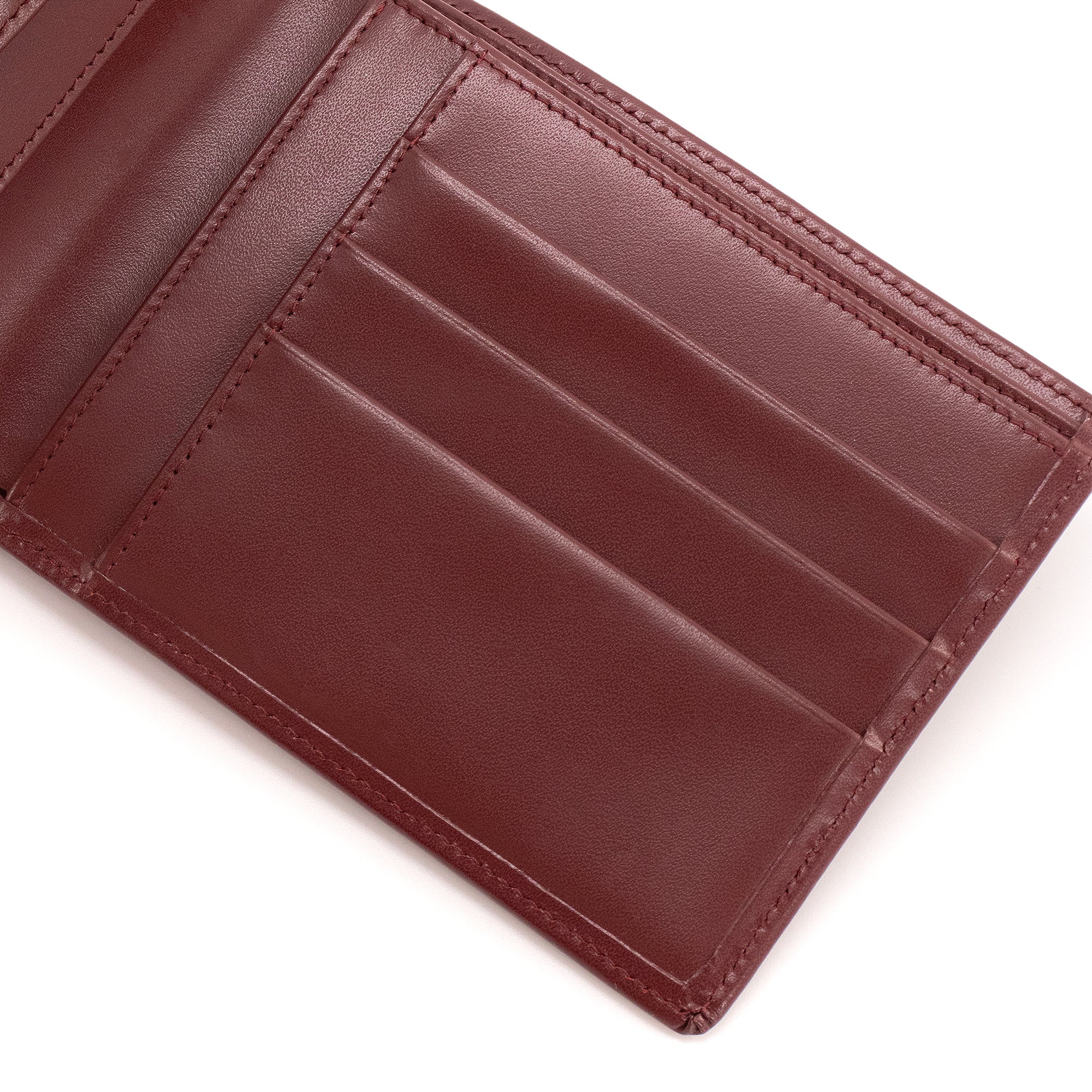 CARTIER - Portefeuille Compact Cartier en cuir bordeaux