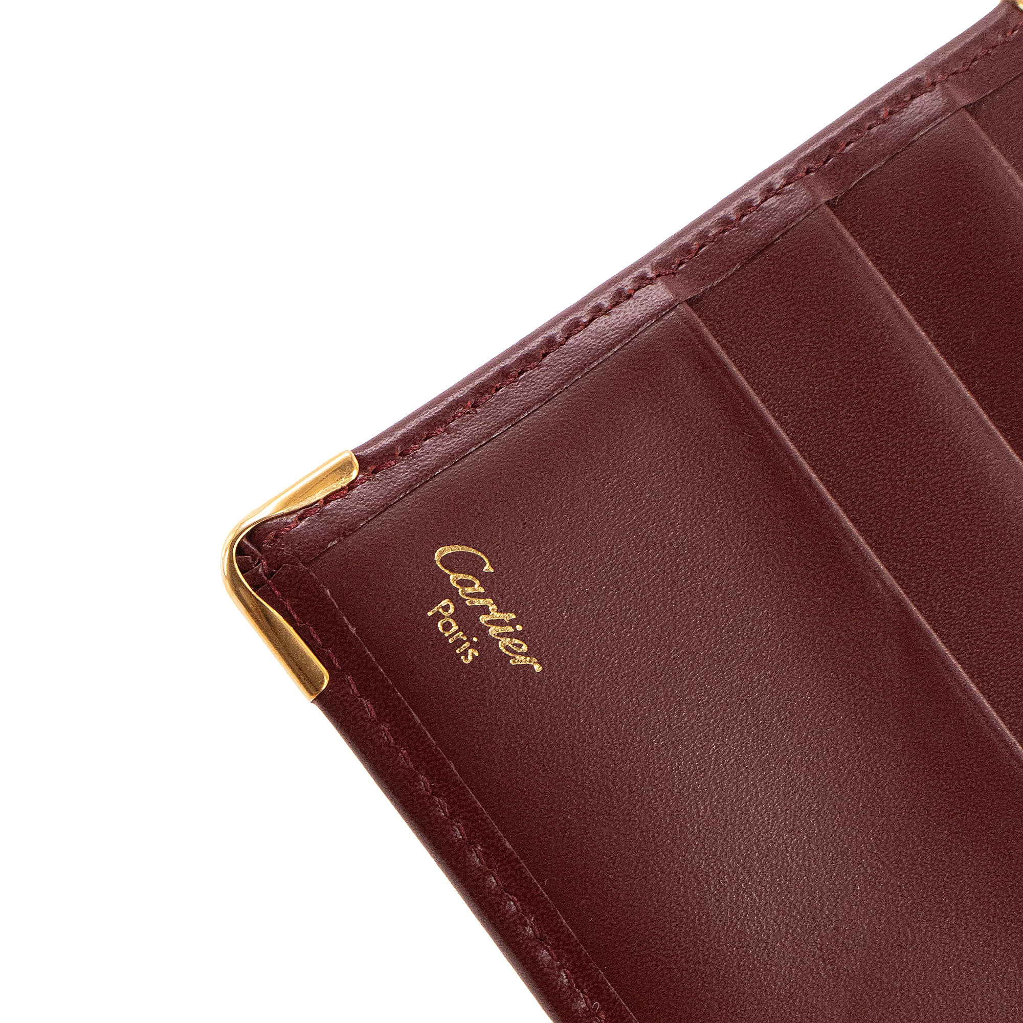 CARTIER - Portefeuille Compact Cartier en cuir bordeaux