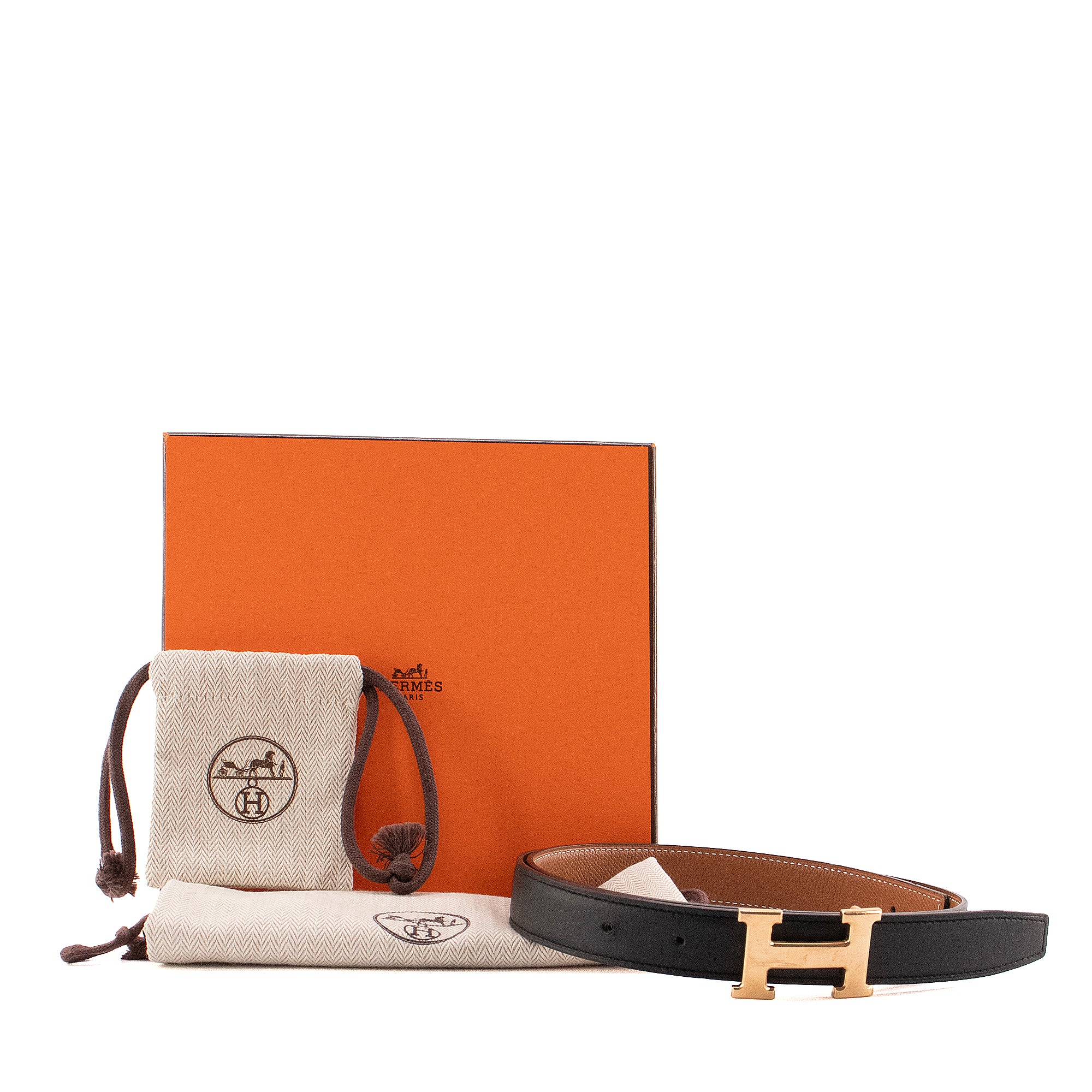 HERMÈS - Ceinture H réversible Hermès en cuir noir et marron (T80)