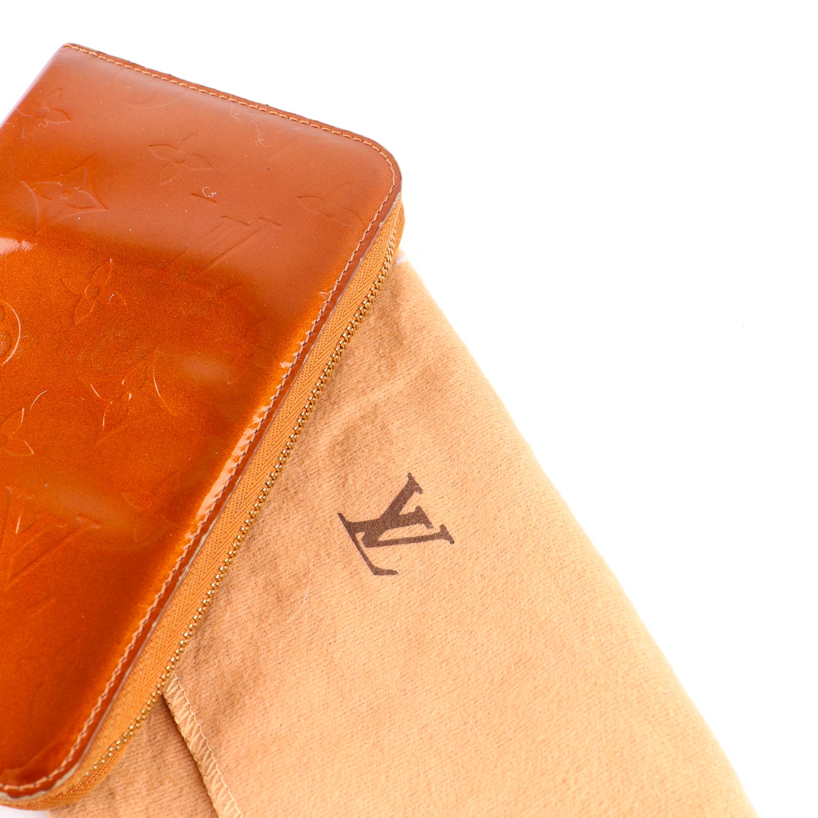 LOUIS VUITTON - Portefeuille en cuir empreinte monogramme verni doré