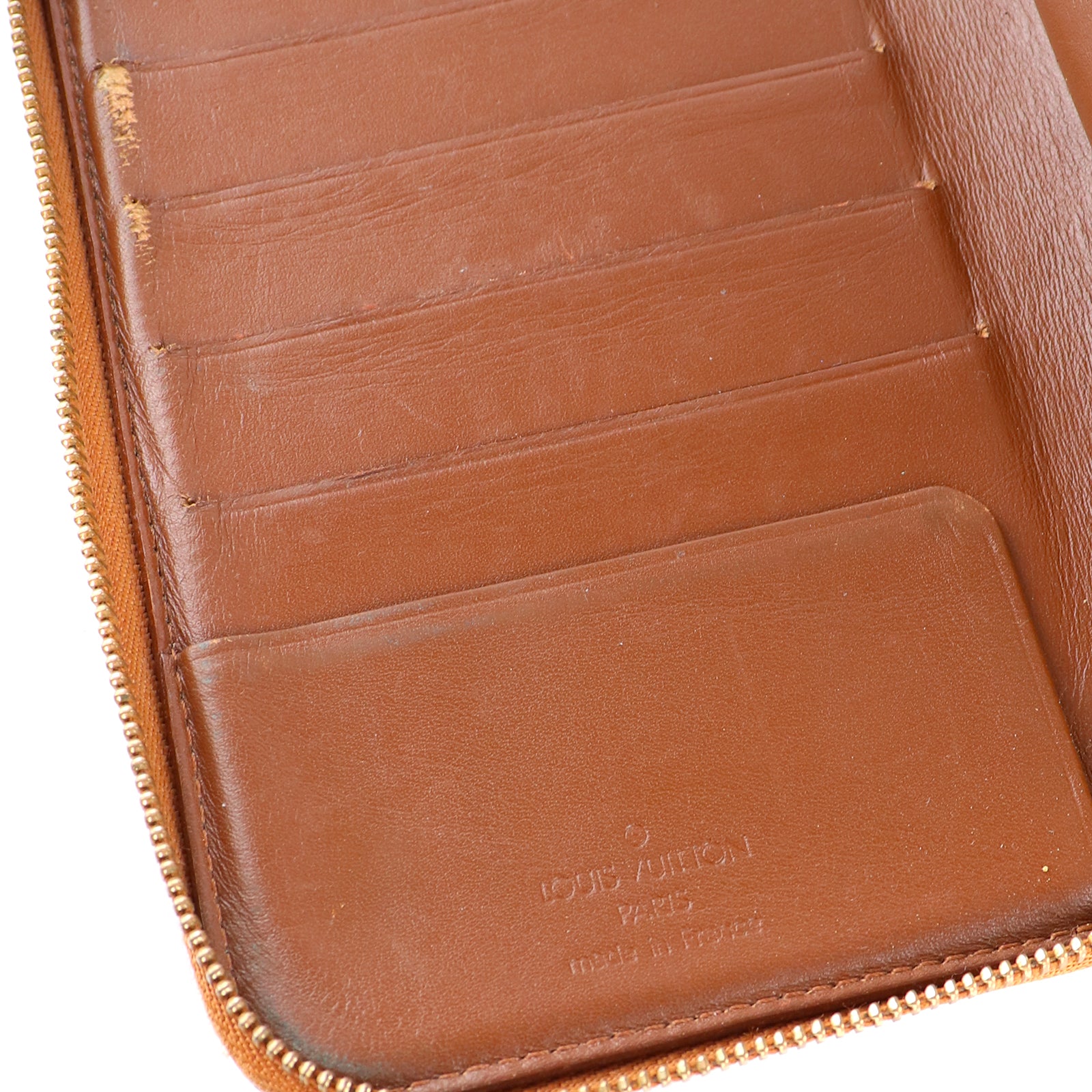 LOUIS VUITTON - Portefeuille en cuir empreinte monogramme verni doré