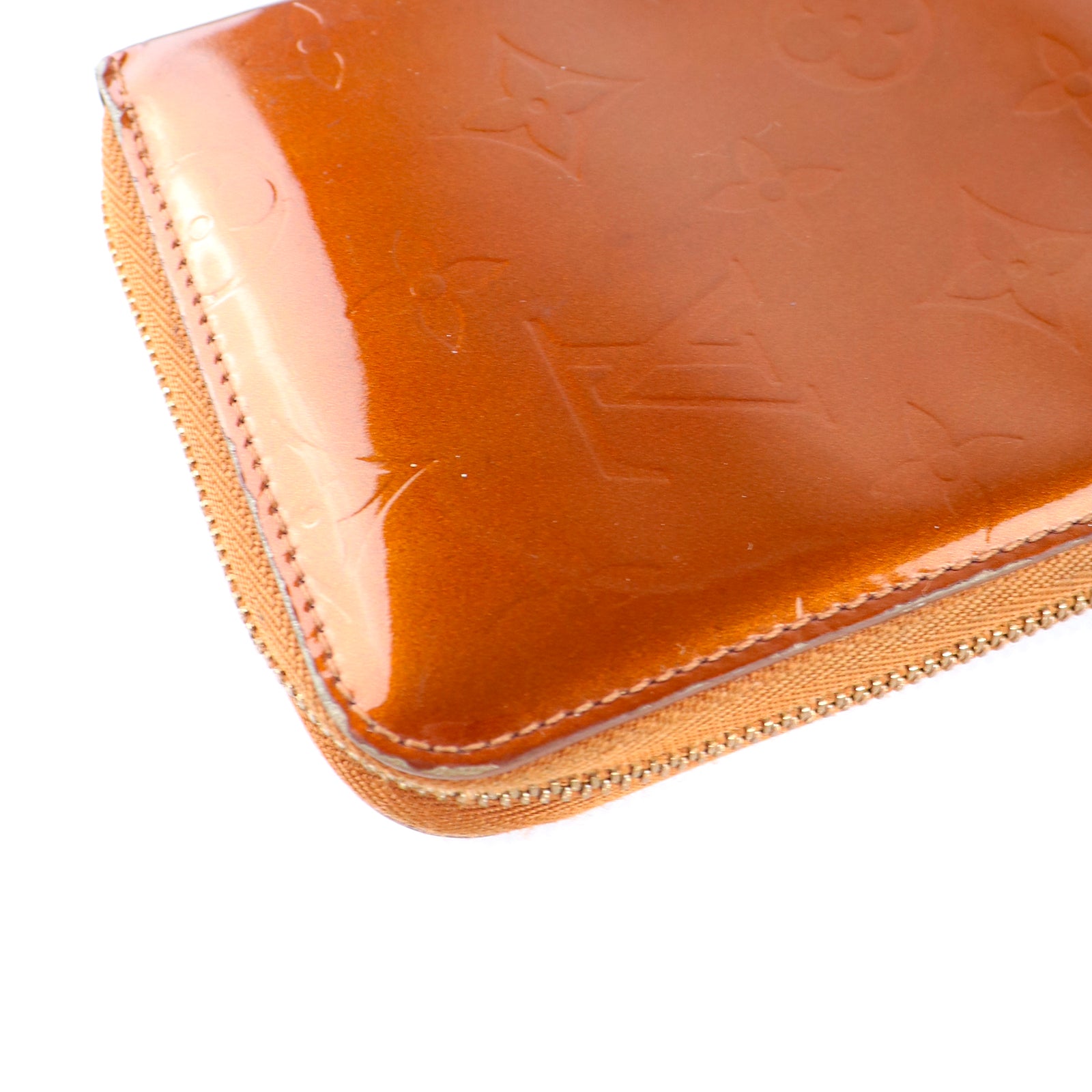 LOUIS VUITTON - Portefeuille en cuir empreinte monogramme verni doré