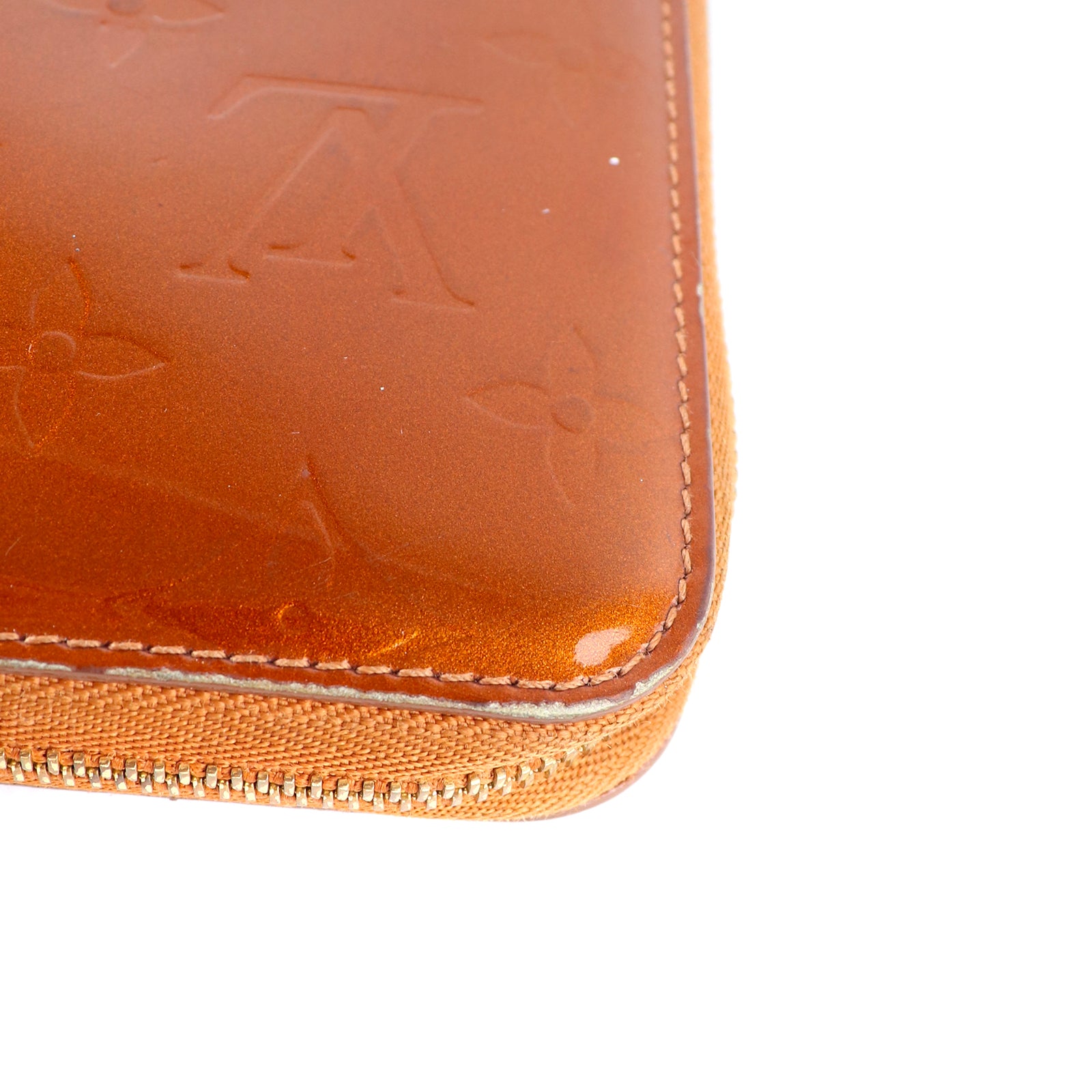 LOUIS VUITTON - Portefeuille en cuir empreinte monogramme verni doré