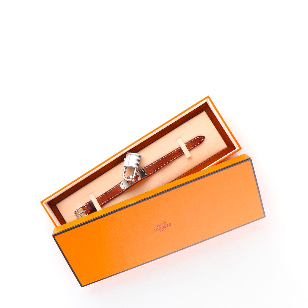 HERMÈS - Montre Kelly en cuir marron