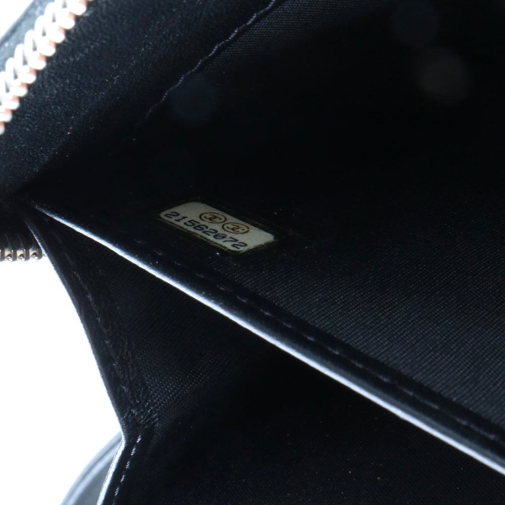 CHANEL - Portefeuille en cuir matelassé noir