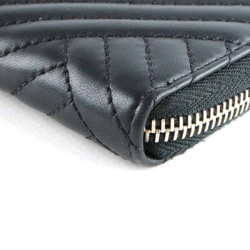 CHANEL - Portefeuille en cuir matelassé noir