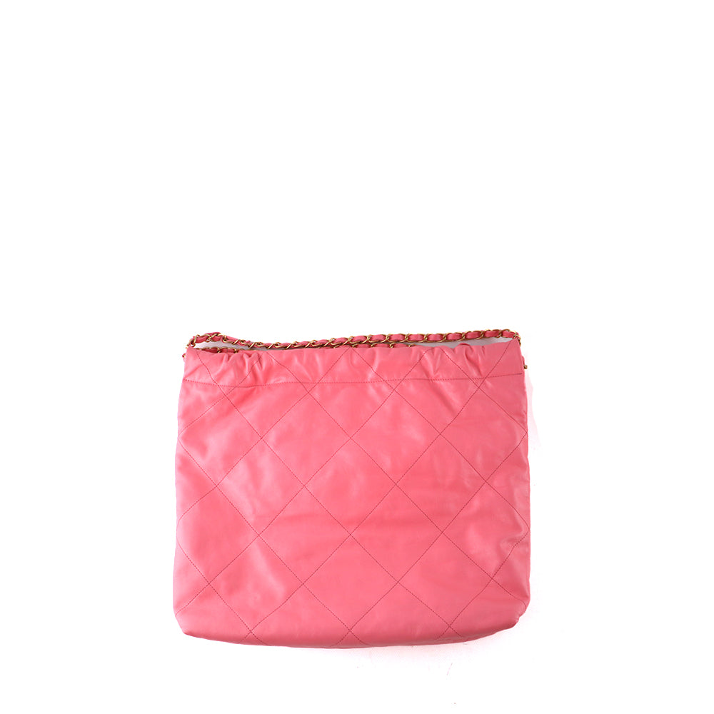 CHANEL - Sac cabas Chanel 22 en cuir matelassé rose et pochette