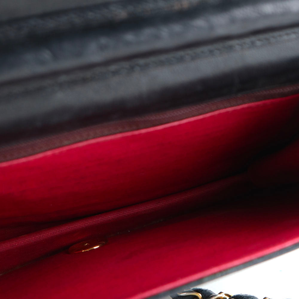 CHANEL - Sac à rabat vintage en cuir matelassé noir