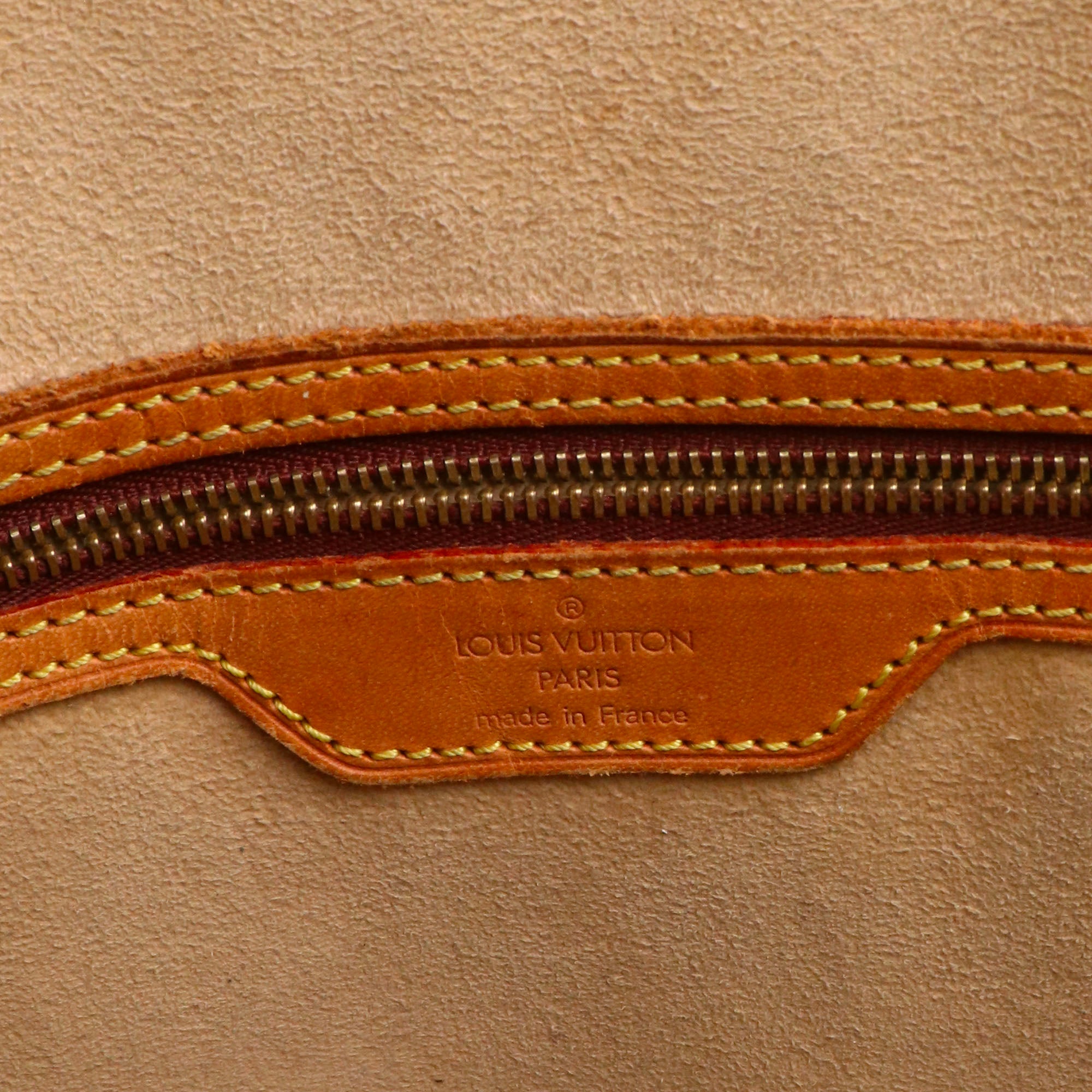 LOUIS VUITTON - Sac cabas Babylone Louis Vuitton en toile monogrammée marron vintage