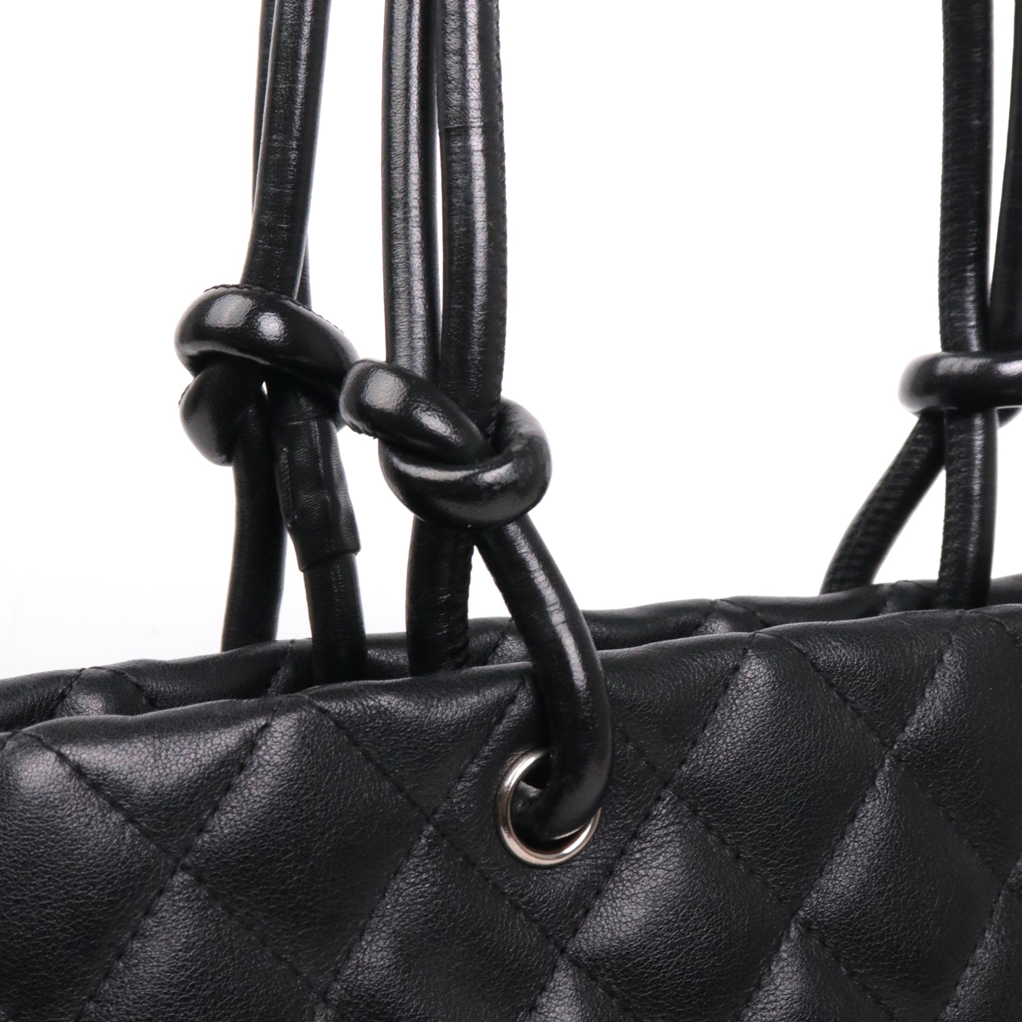 CHANEL - Cambon handbag in beige and black quilted leather
