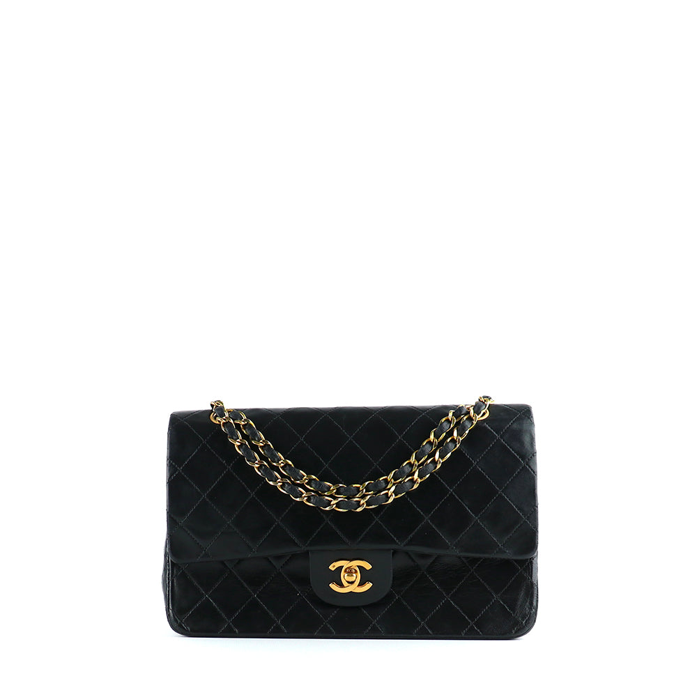 CHANEL - Sac à main Timeless 25 double flap en cuir matelassé noir vintage
