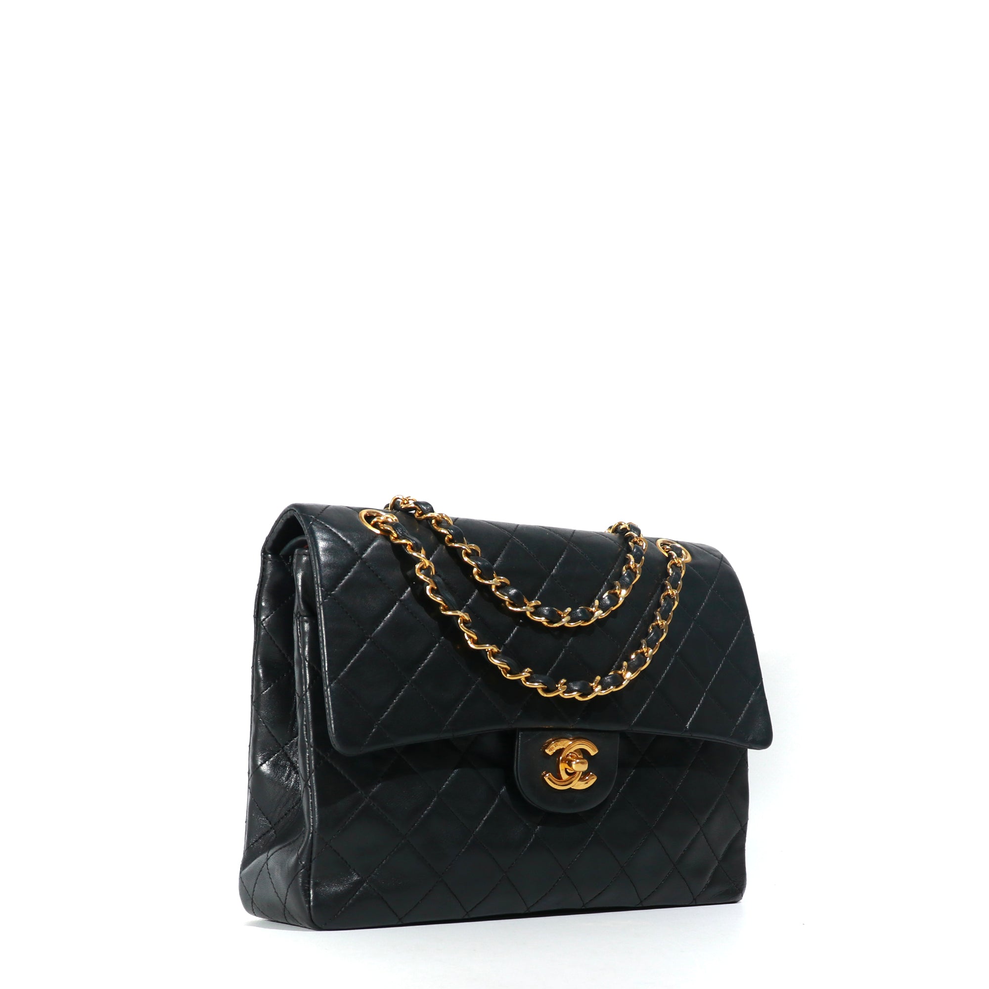CHANEL - Sac à main Timeless 25 double flap en cuir matelassé noir vintage