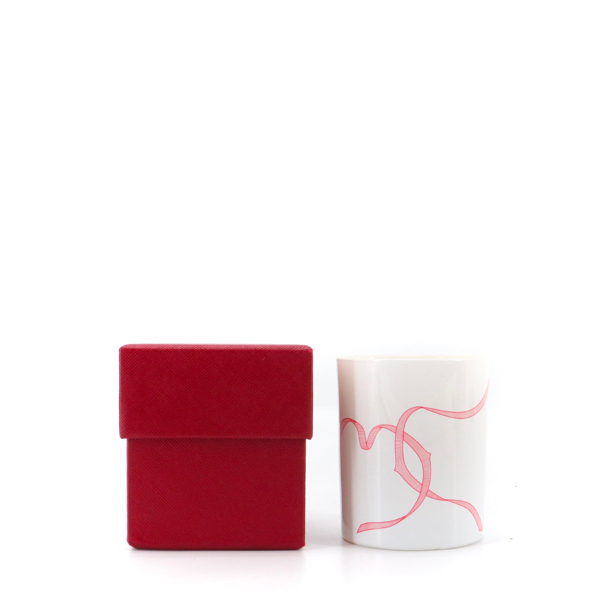 CARTIER - Bougie parfumée Cartier en verre blanc et rouge
