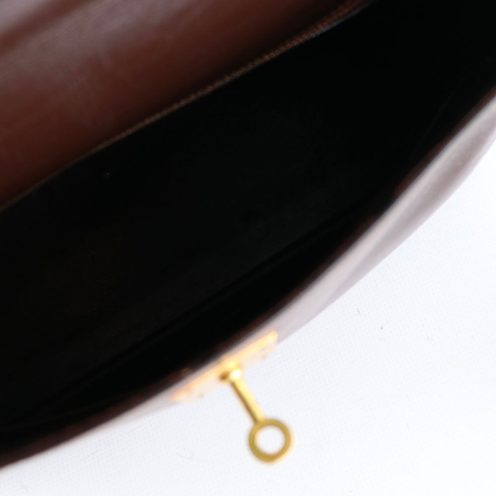 HERMÈS - Sac à main Kelly 32 en cuir box chocolat vintage