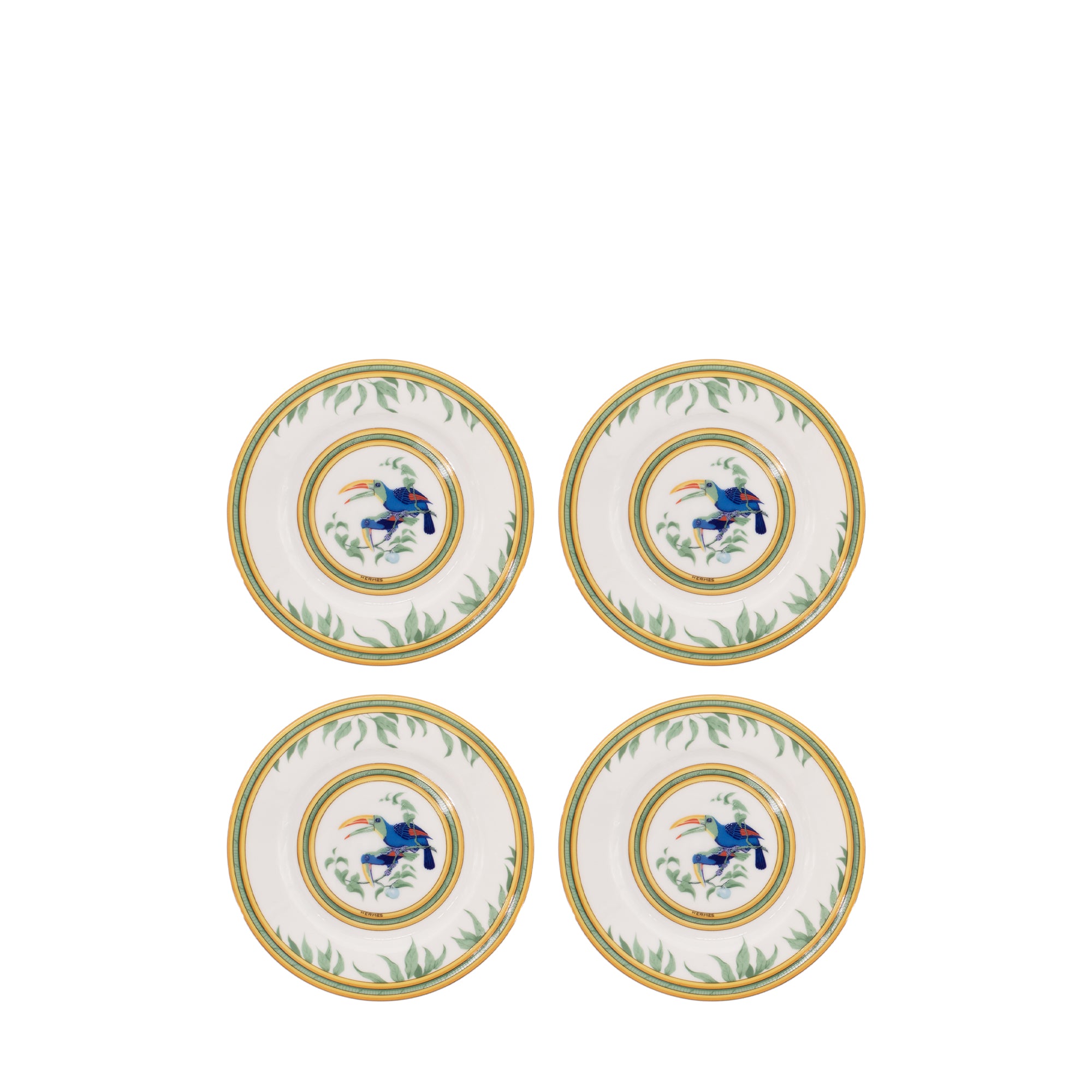 HERMÈS - Lot de quatre assiettes à pain Toucans Hermès en porcelaine multicolore