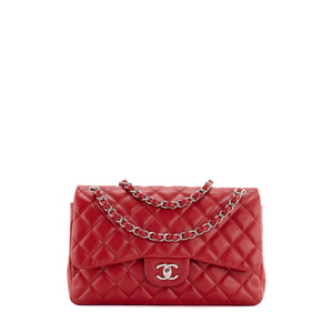 CHANEL - Sac à bandoulière Classique/Timeless Jumbo Chanel en cuir caviar rouge