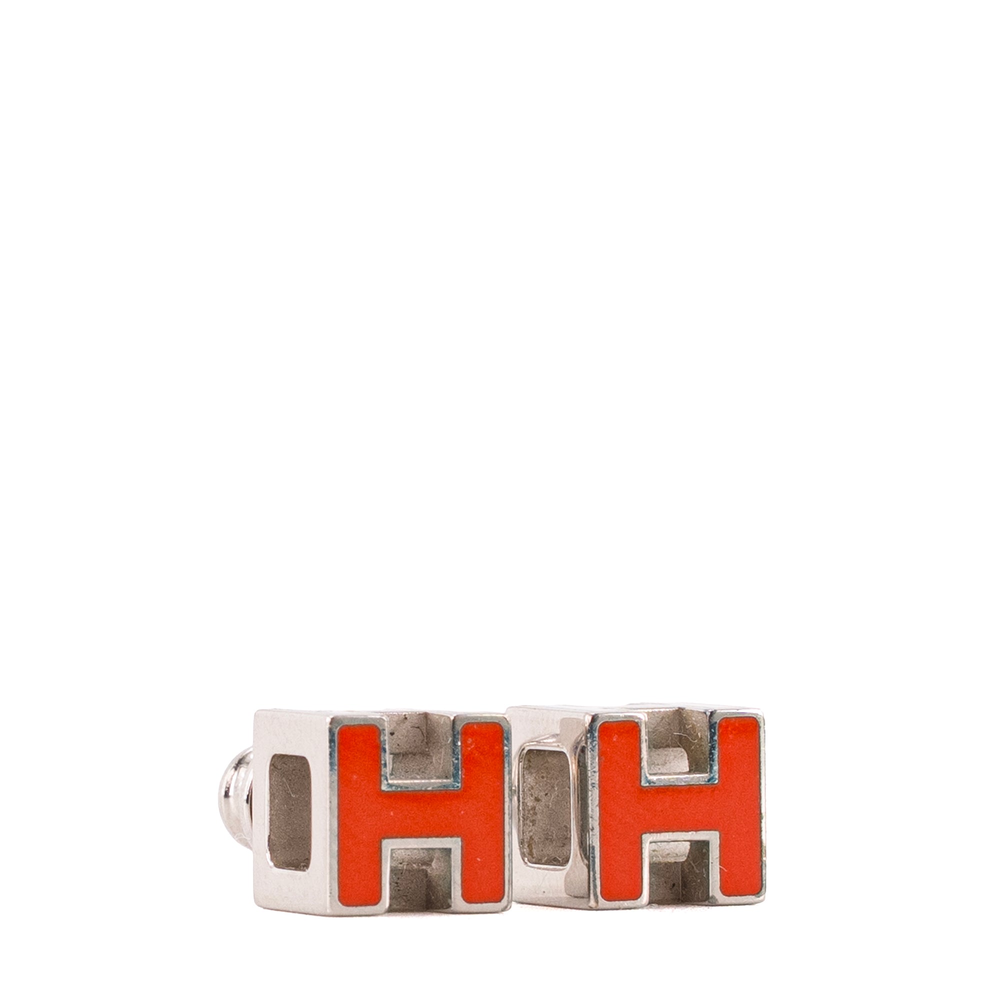 HERMÈS - Boucles d'oreilles Cage d'H Hermès en métal argenté et émail orange