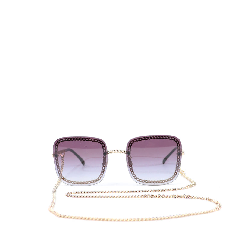 CHANEL - Lunettes de soleil avec chaîne