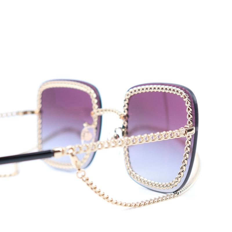 CHANEL - Lunettes de soleil avec chaîne