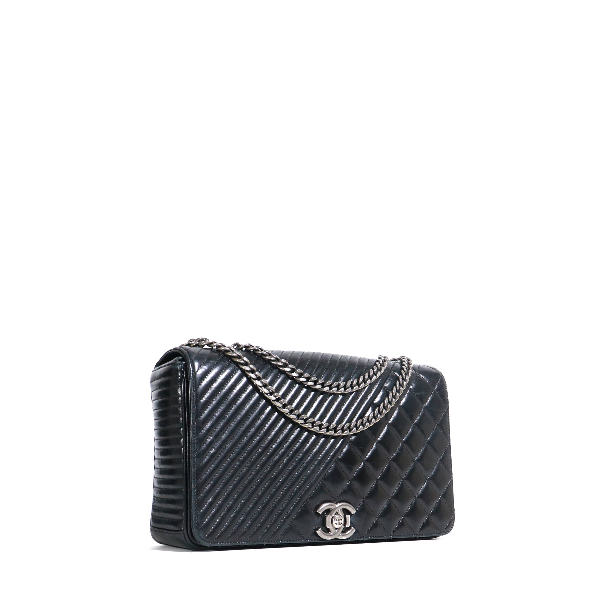 CHANEL - Coco Boy shoulder bag in black quilted leather