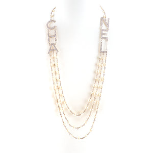 CHANEL - B19 long necklace with pearls and Strass logo