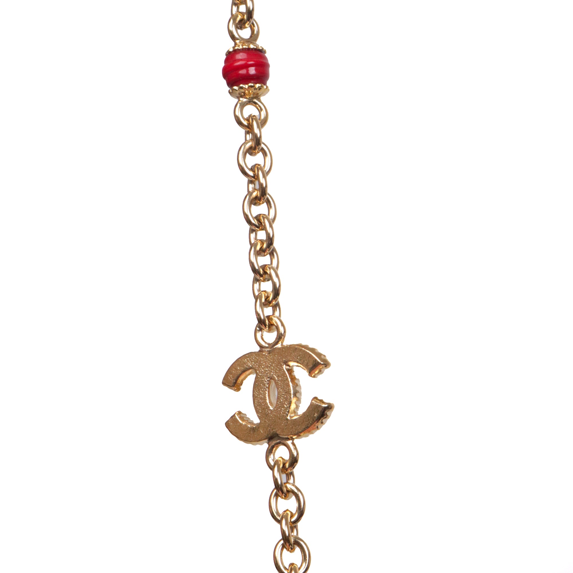 CHANEL - Sautoir CC Chanel en métal doré orné de pierres bordeaux