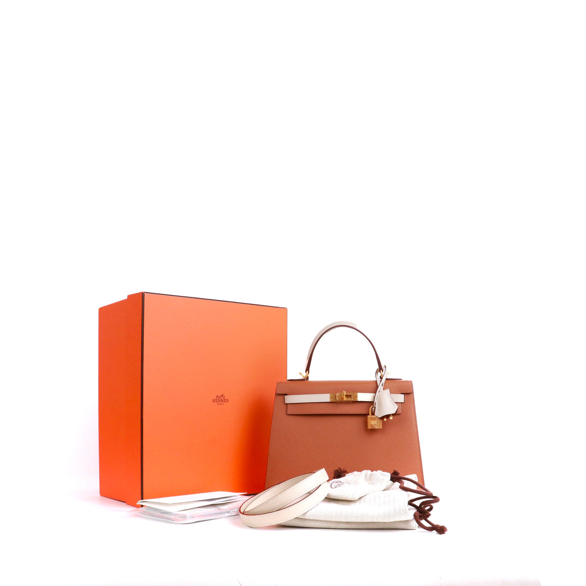 HERMÈS - Sac à main Kelly 25 Hermès bicolore en cuir epsom gold et craie