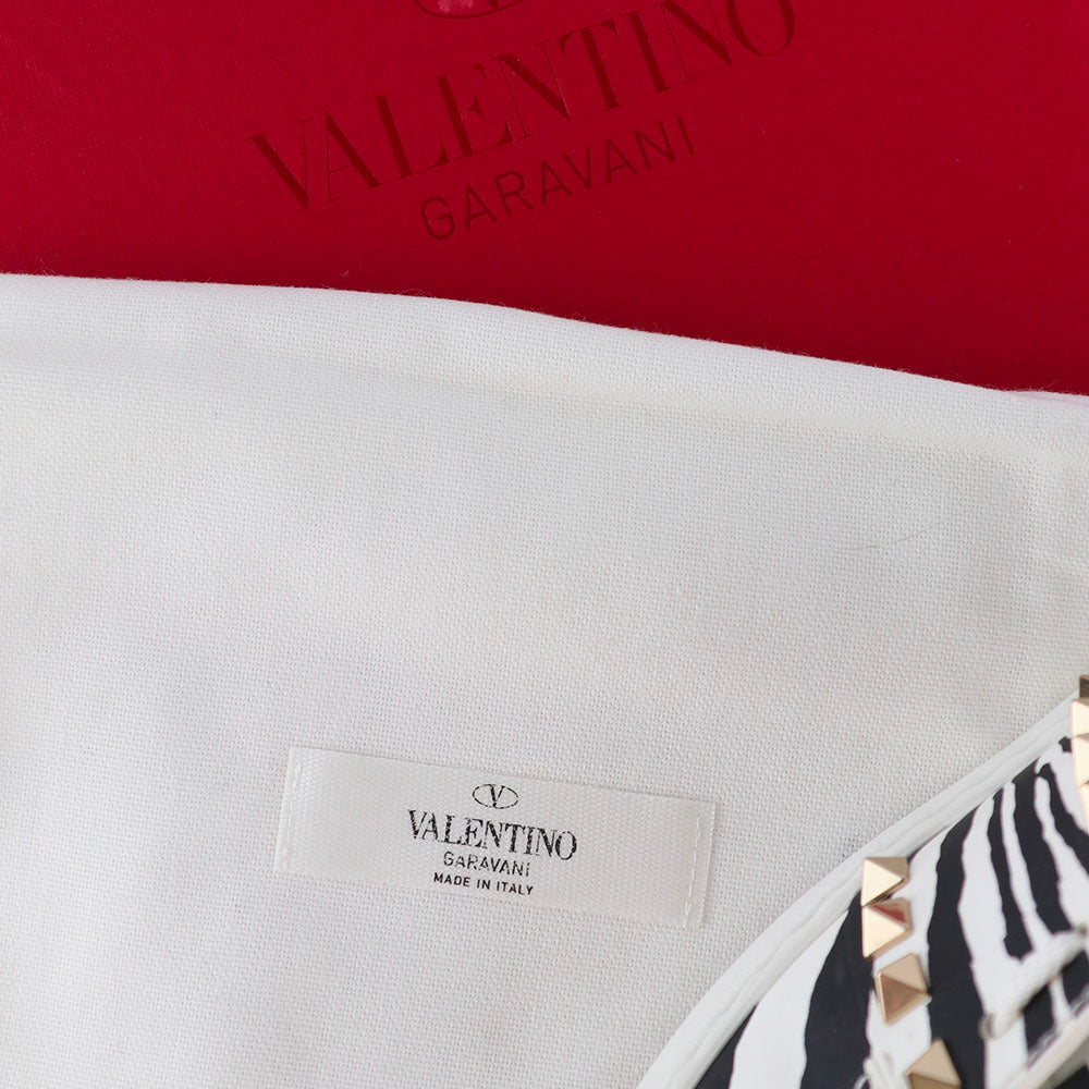 VALENTINO - Sneakers Rockstud en cuir blanc motif zèbre (T36)