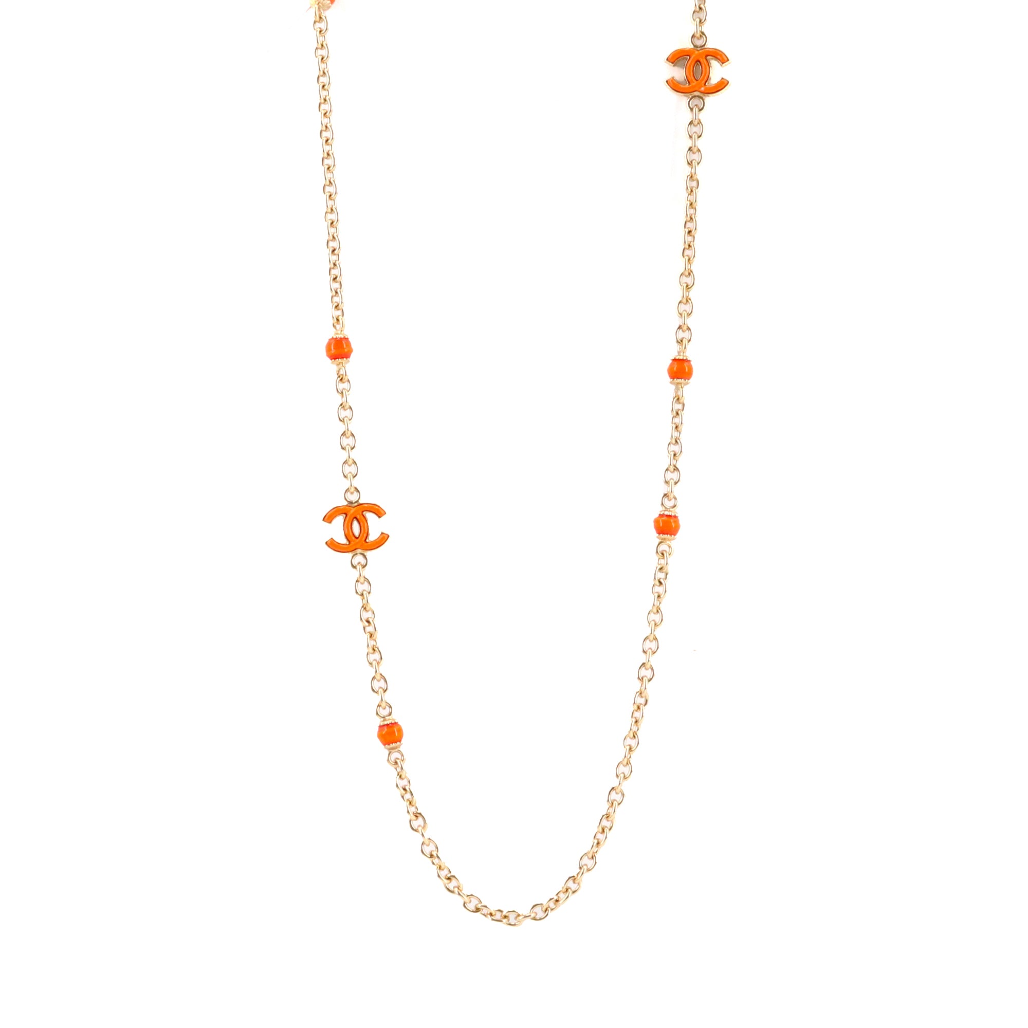CHANEL - Sautoir CC Chanel en métal doré orné de pierres orange
