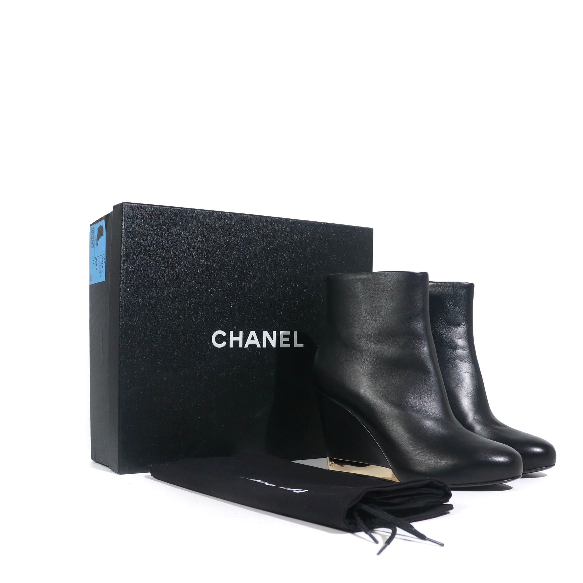 CHANEL - Bottines à talons compensés en cuir noir (T39)