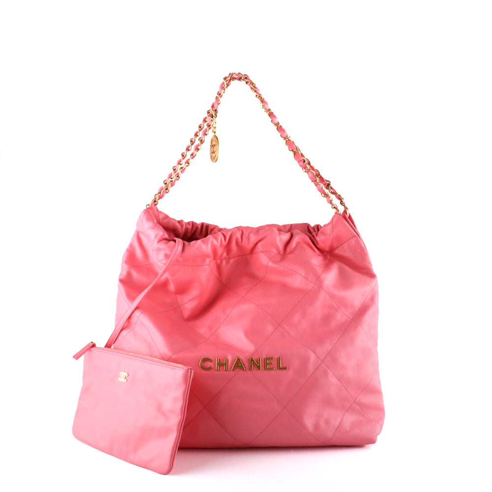 CHANEL - Sac cabas Chanel 22 en cuir matelassé rose et pochette