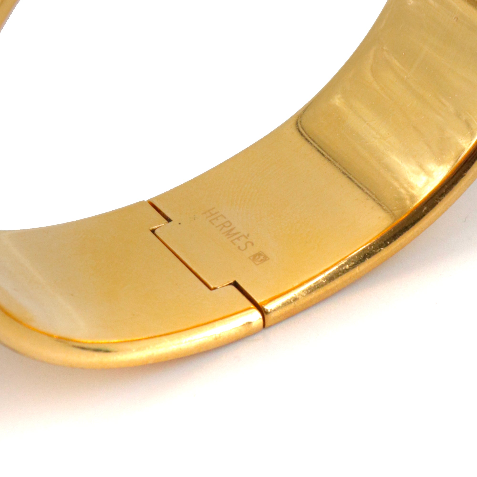 HERMÈS - Bracelet Jonc Hermès en métal doré et émail motif éventail