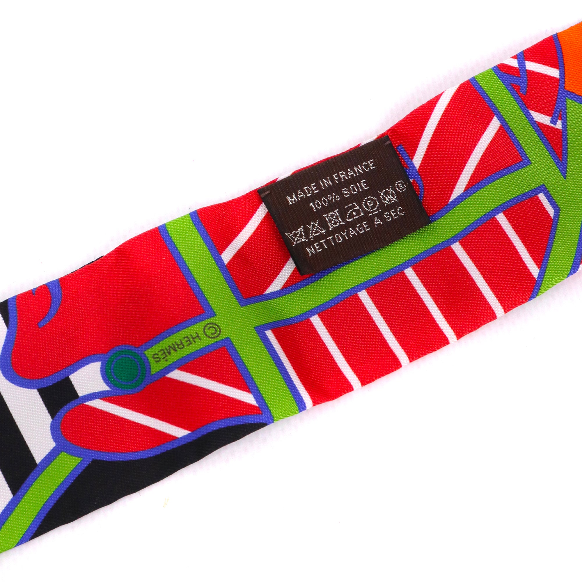 HERMÈS - Twilly Quadrige Hermès en soie multicolore
