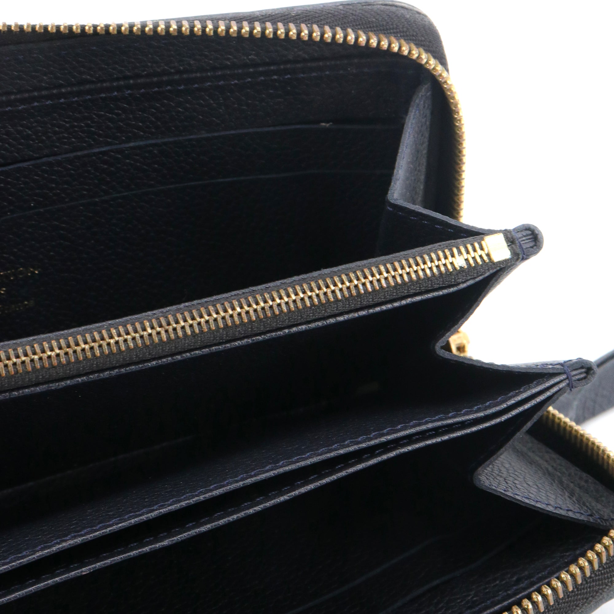 LOUIS VUITTON - Portefeuille Zippy Louis Vuitton en cuir empreinte bleu marine
