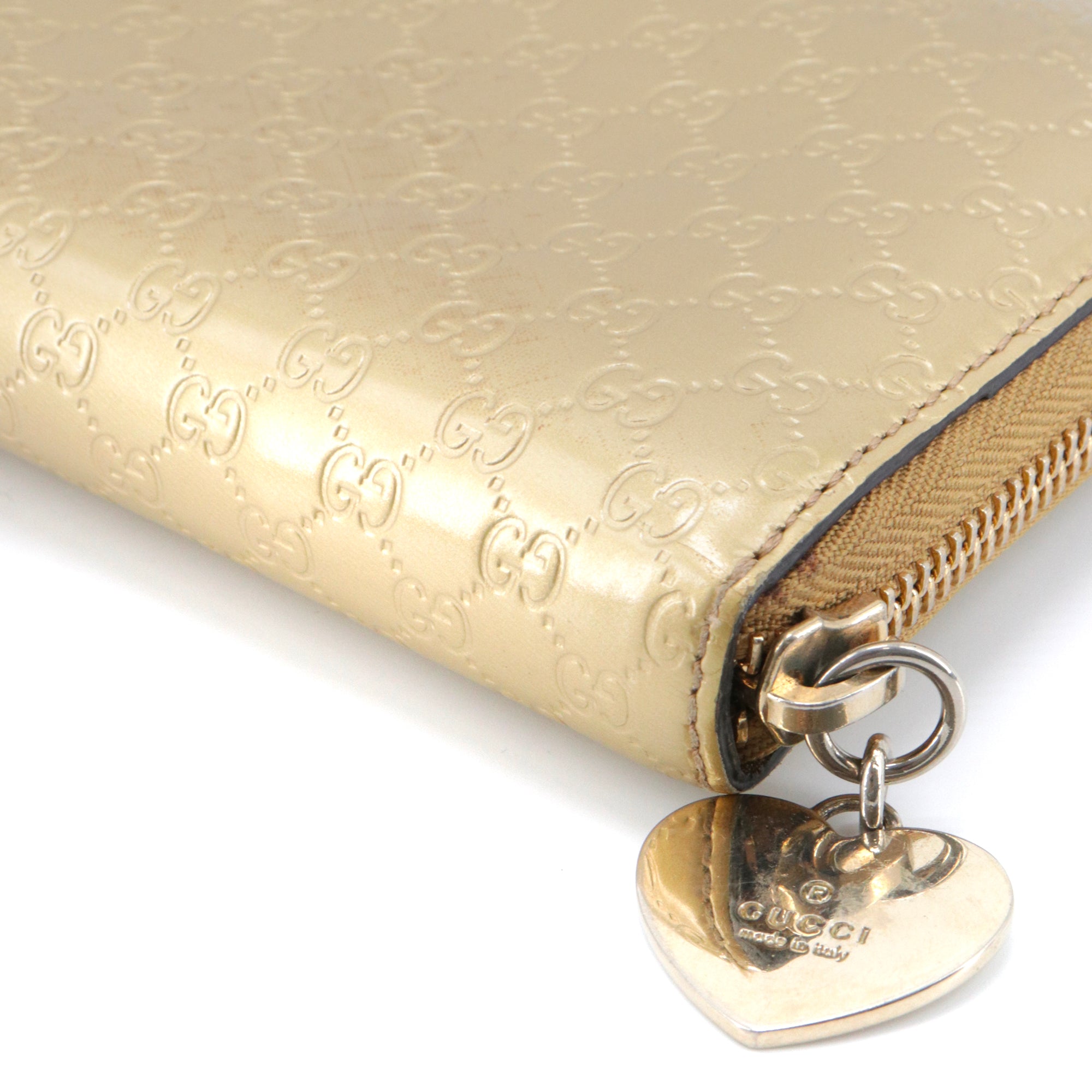 GUCCI - Grand portefeuille Gucci en cuir verni doré