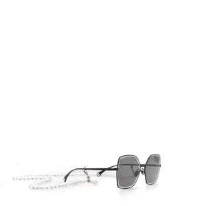 CHANEL - Lunettes de soleil Chanel en métal noir avec chaîne en perles