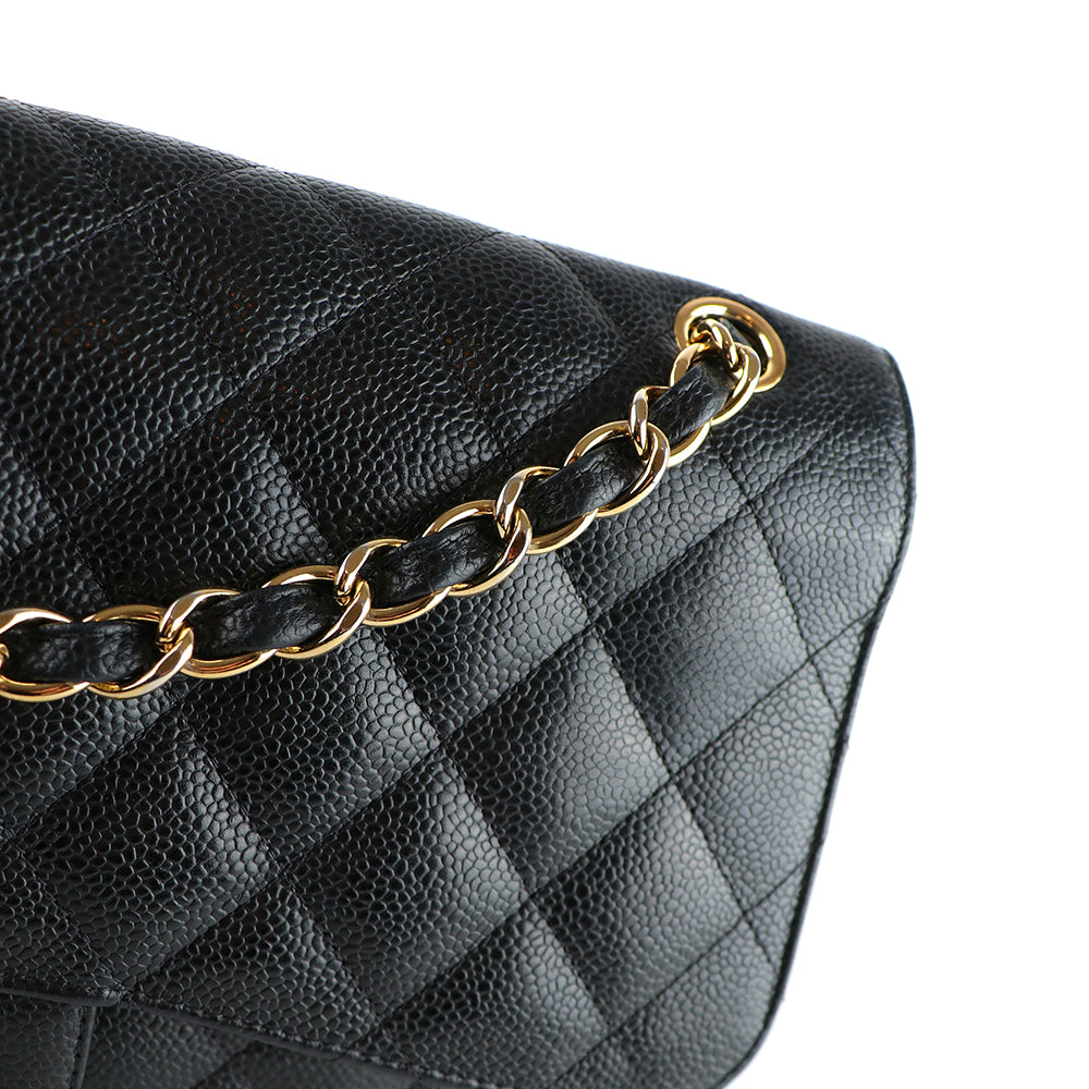 CHANEL - Sac à bandoulière Classique / Timeless Jumbo double flap en cuir caviar noir