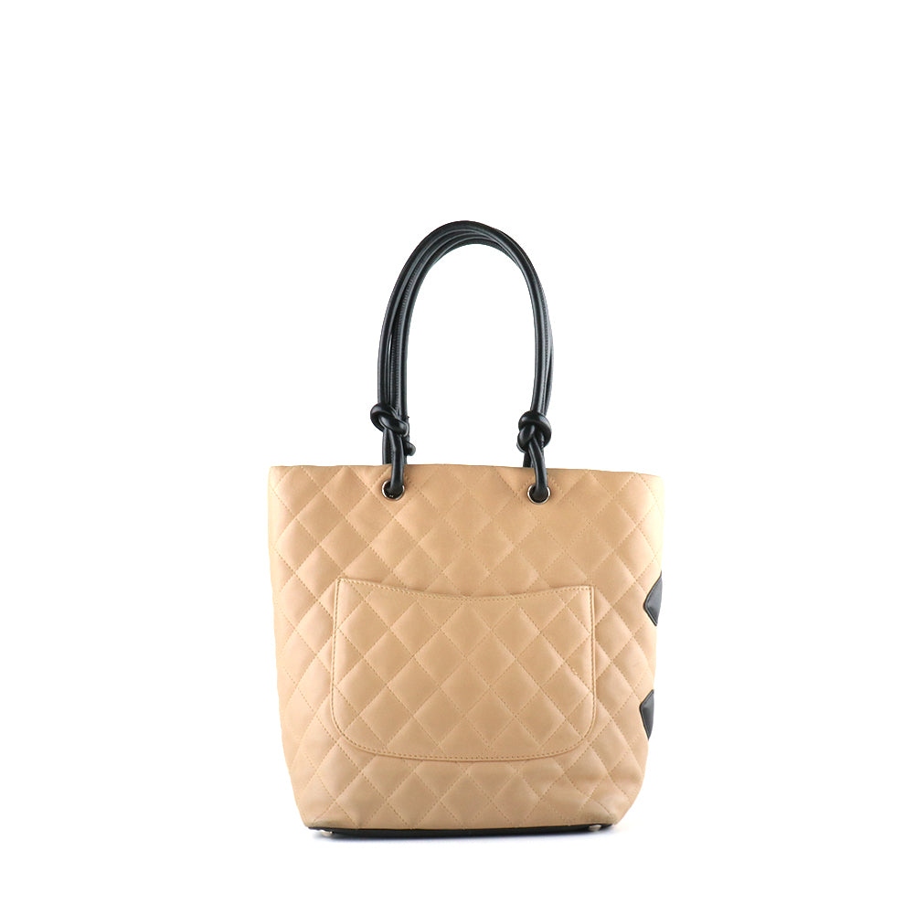CHANEL - Sac à main Cambon en cuir matelassé beige et noir vintage