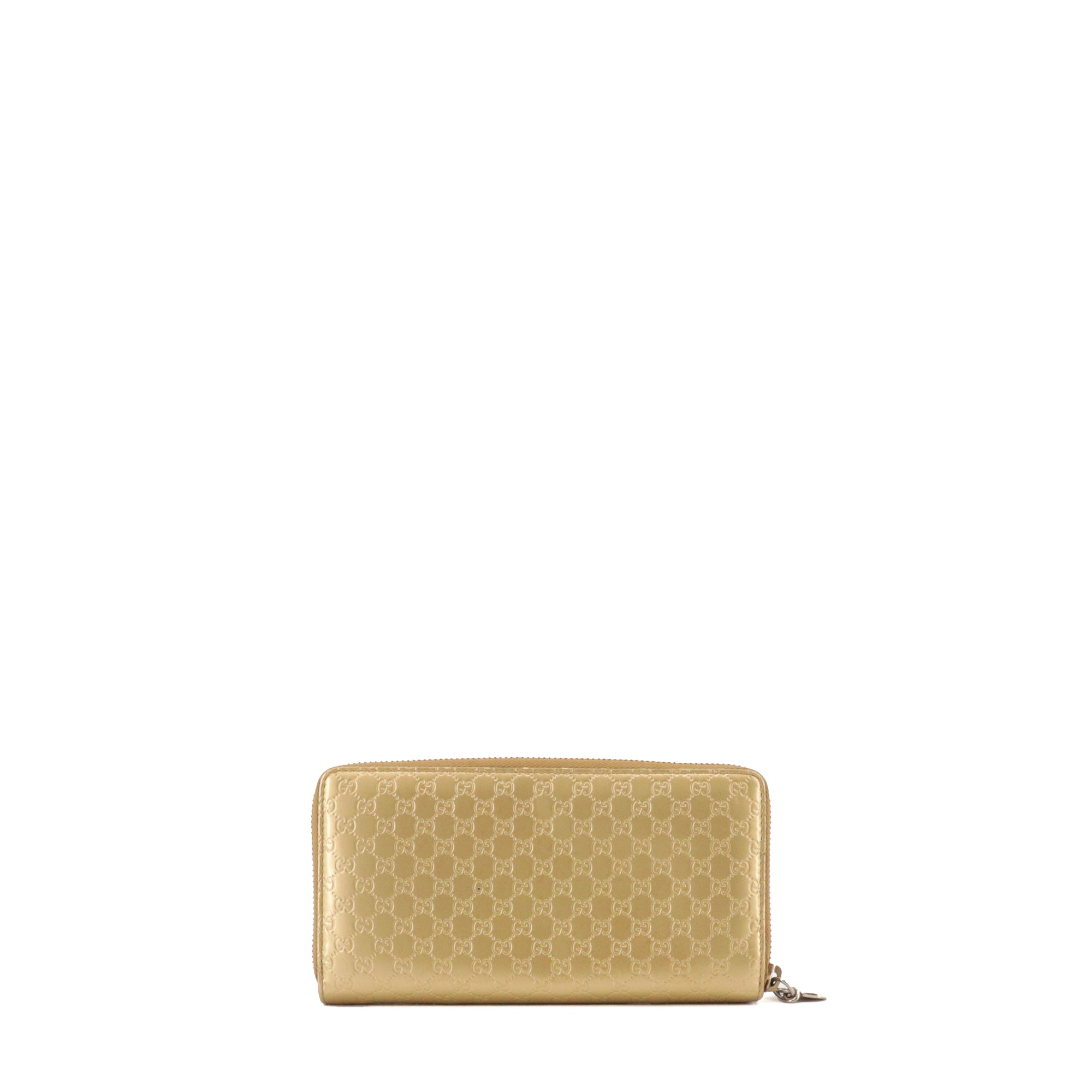 GUCCI - Grand portefeuille Gucci en cuir verni doré