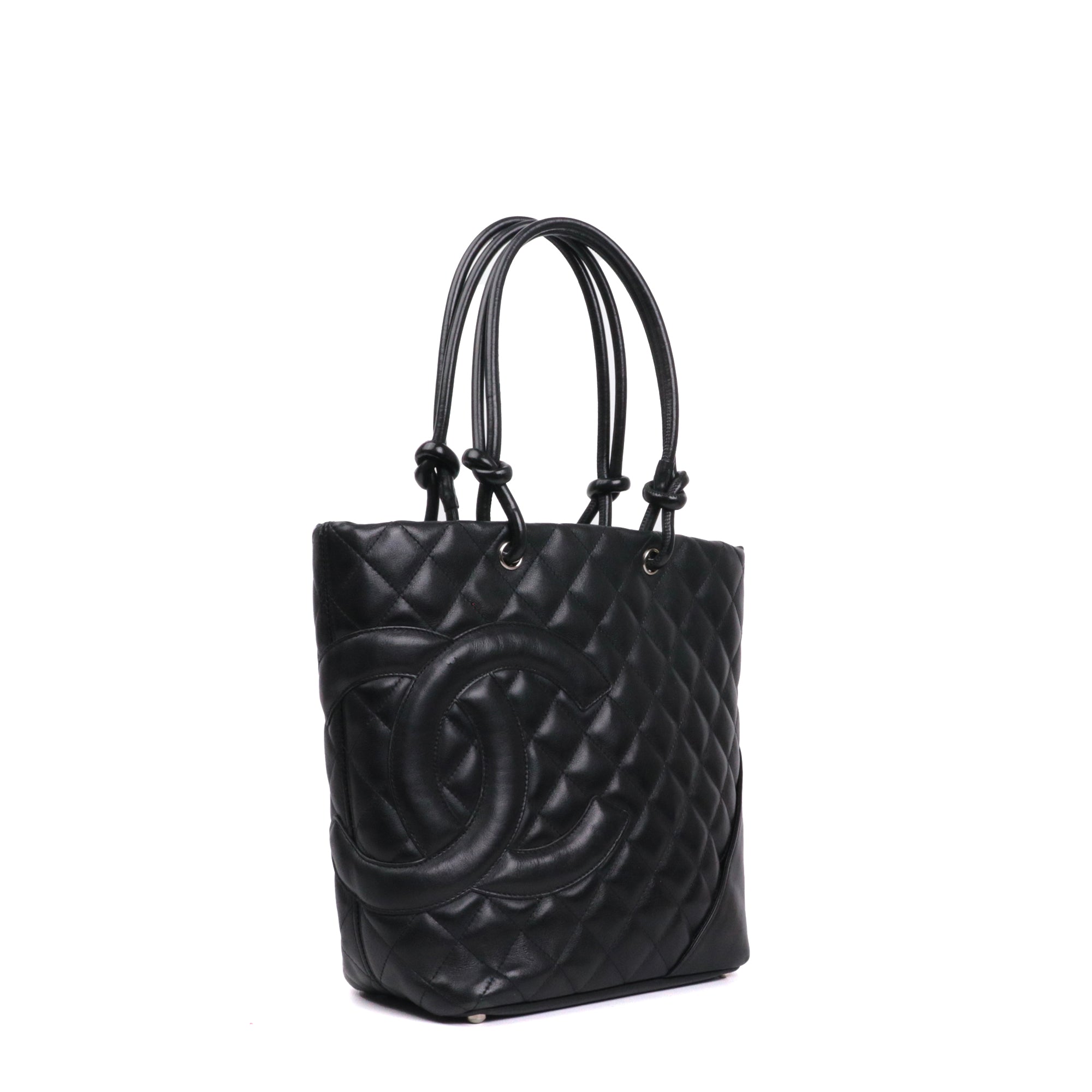 CHANEL - Cambon handbag in beige and black quilted leather