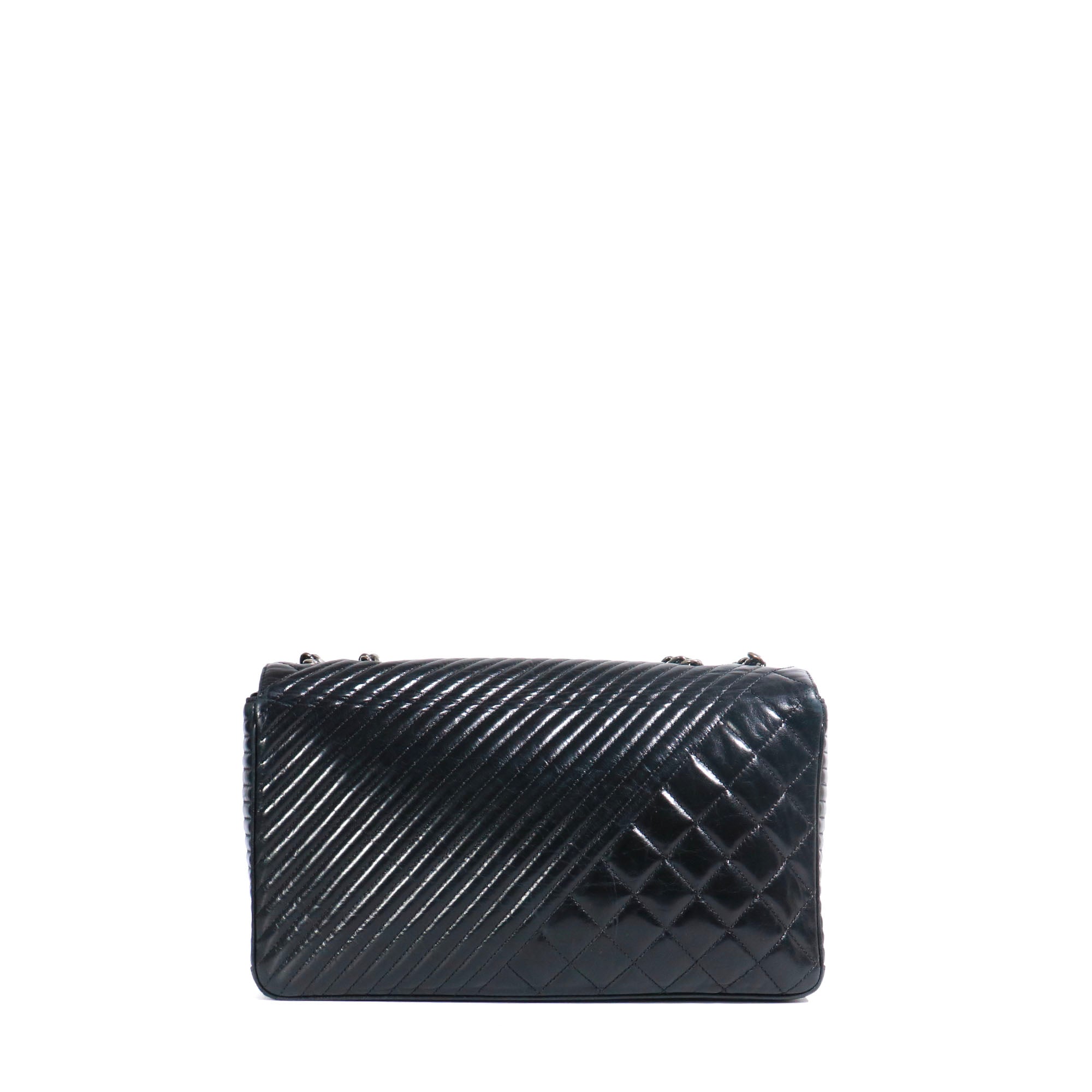 CHANEL - Coco Boy shoulder bag in black quilted leather