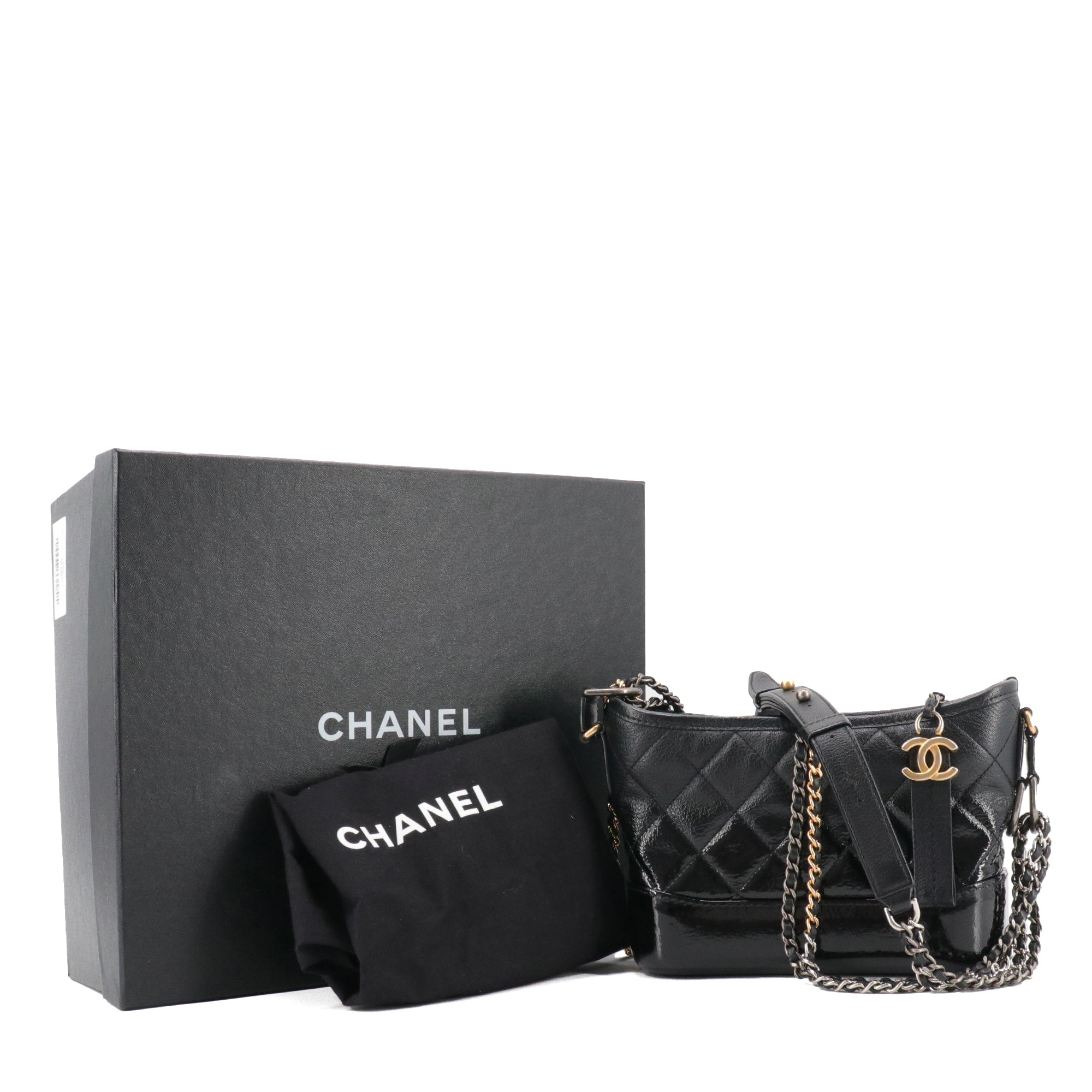 CHANEL - Chanel Gabrielle mini shoulder bag in black smooth and patent leather