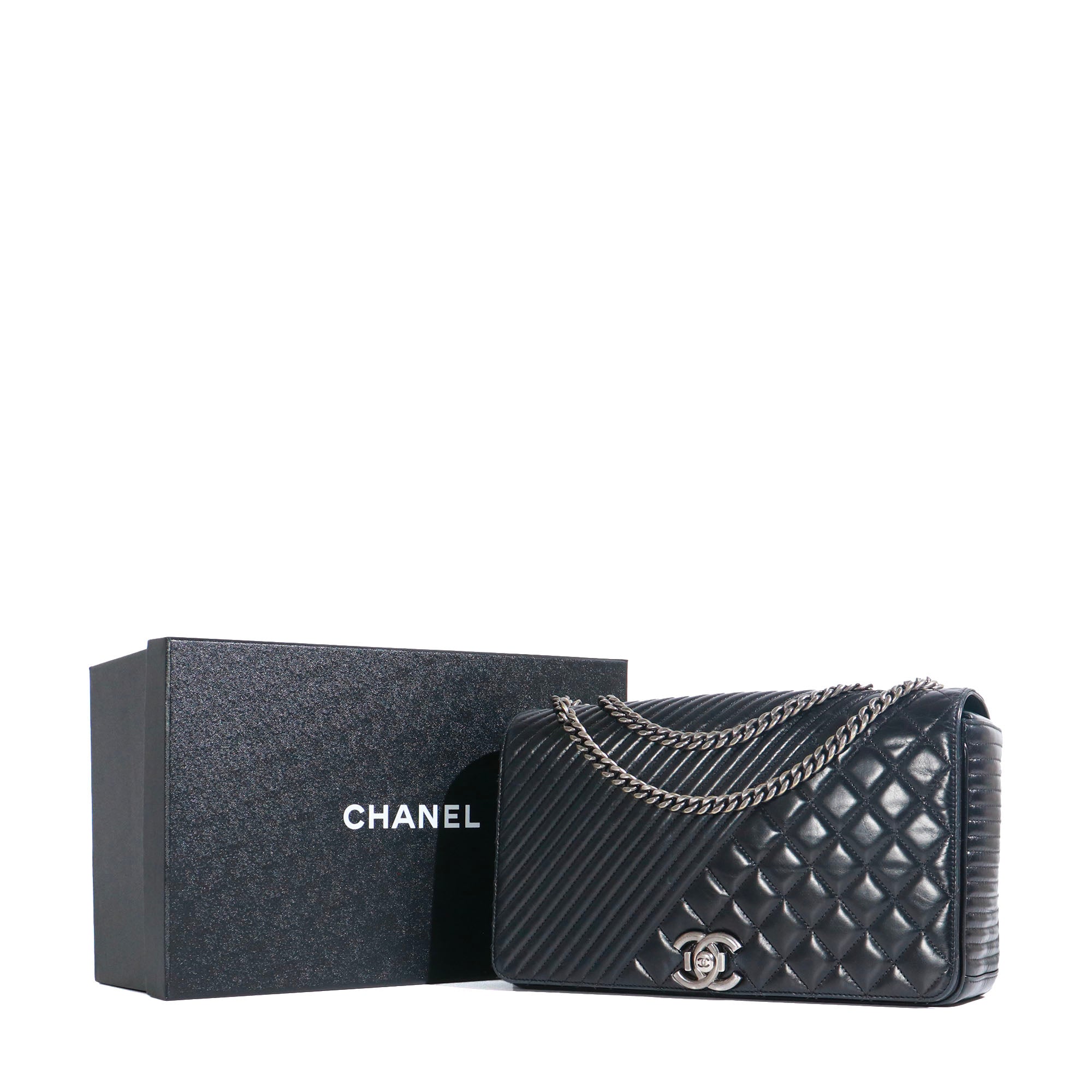 CHANEL - Coco Boy shoulder bag in black quilted leather