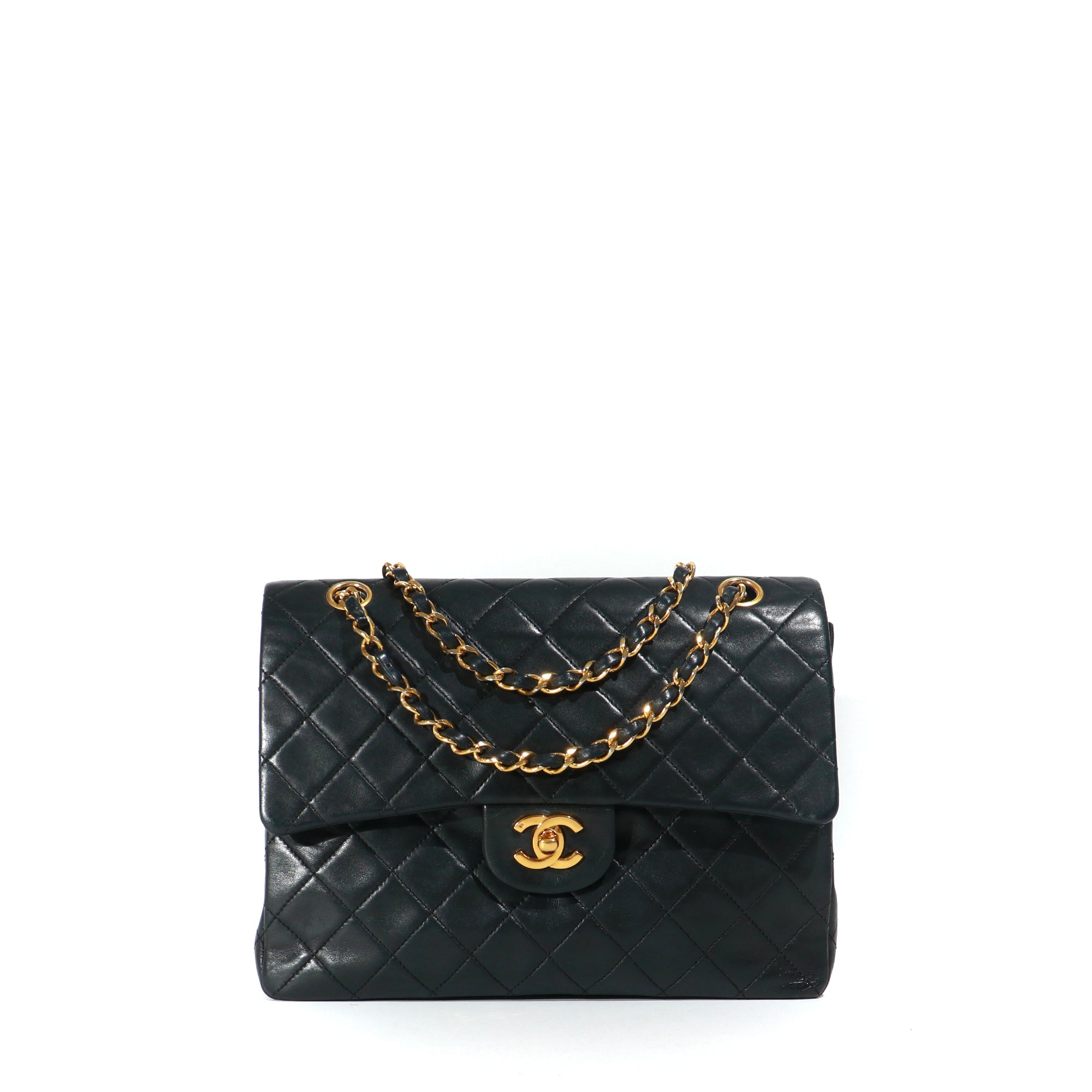 CHANEL - Sac à main Timeless 25 double flap en cuir matelassé noir vintage