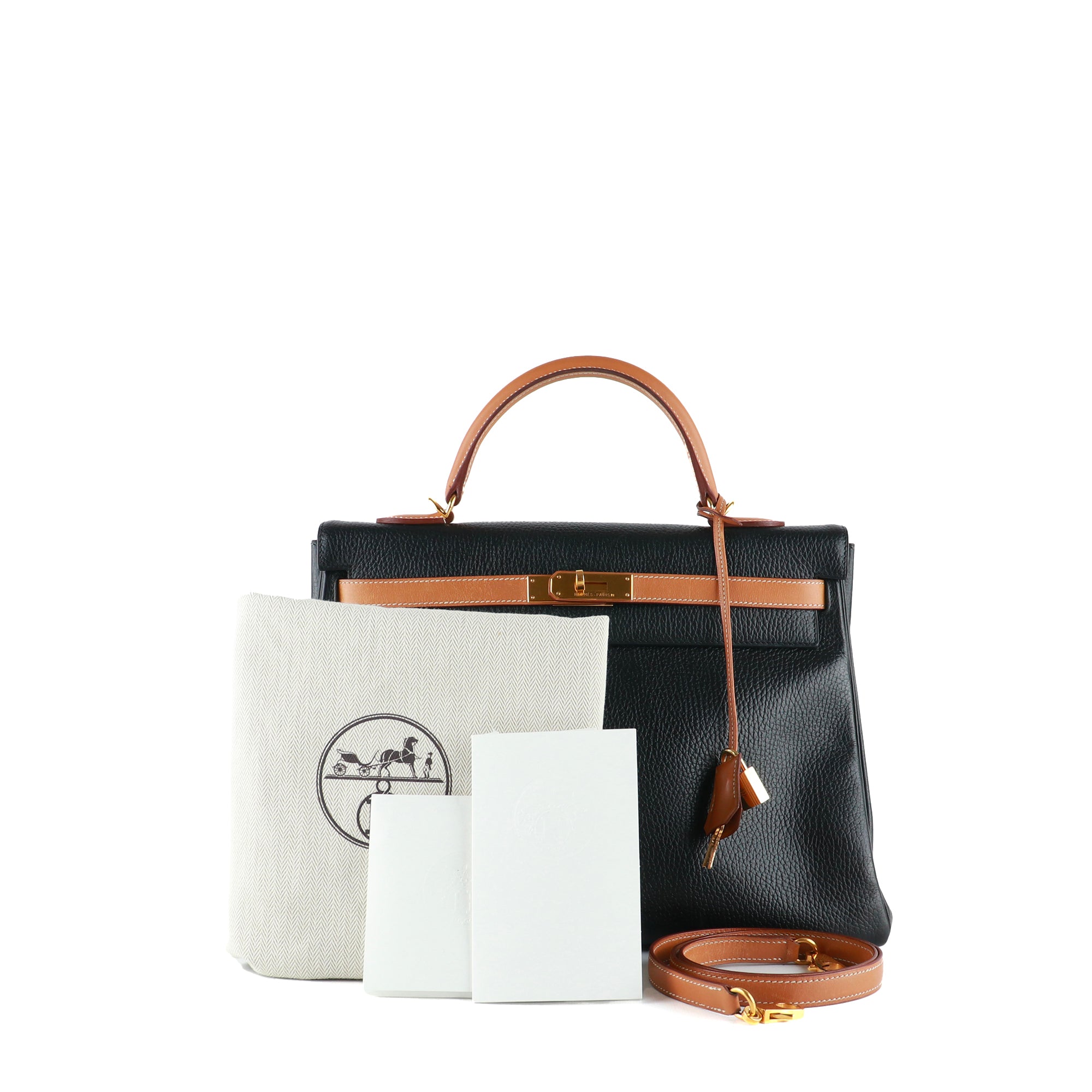 HERMÈS - Sac à main Kelly 35 en cuir togo bicolore noir et gold