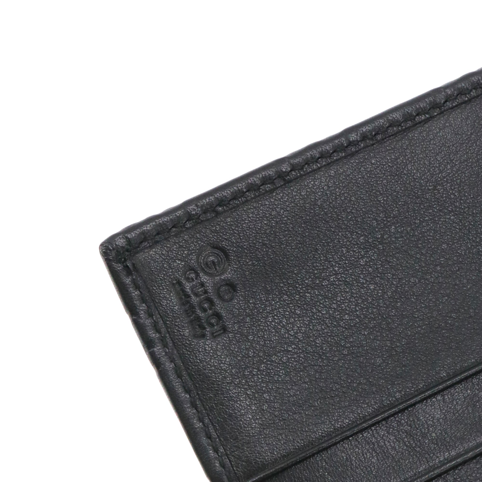 GUCCI - Portefeuille Guccissima Gucci en cuir embossé noir