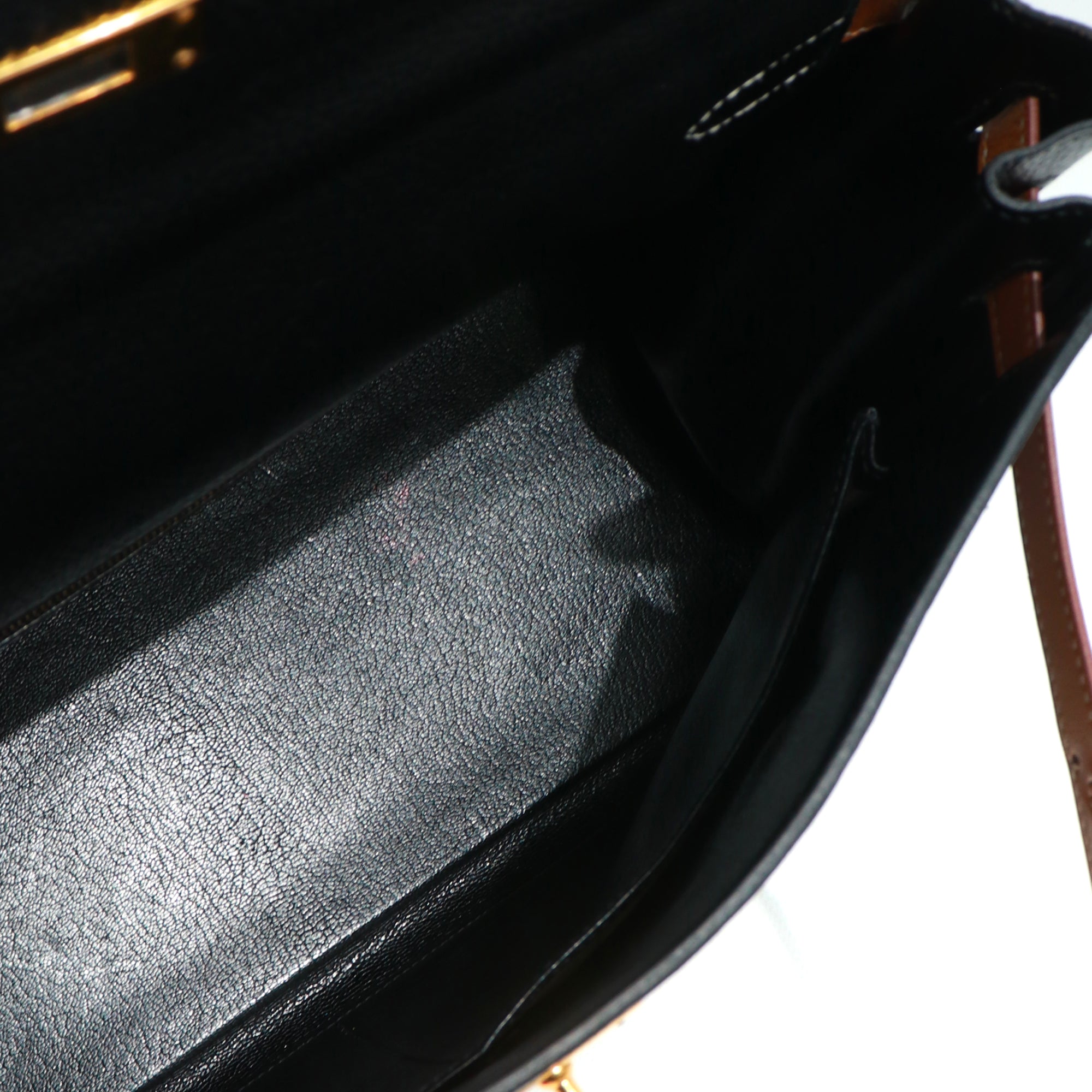 HERMÈS - Sac à main Kelly 35 en cuir togo bicolore noir et gold