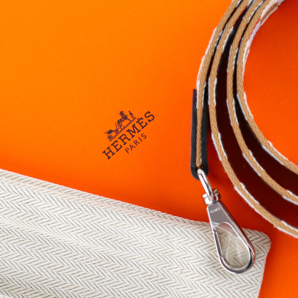 HERMÈS - Sac à bandoulière Evelyne mini en cuir Clémence orange doux