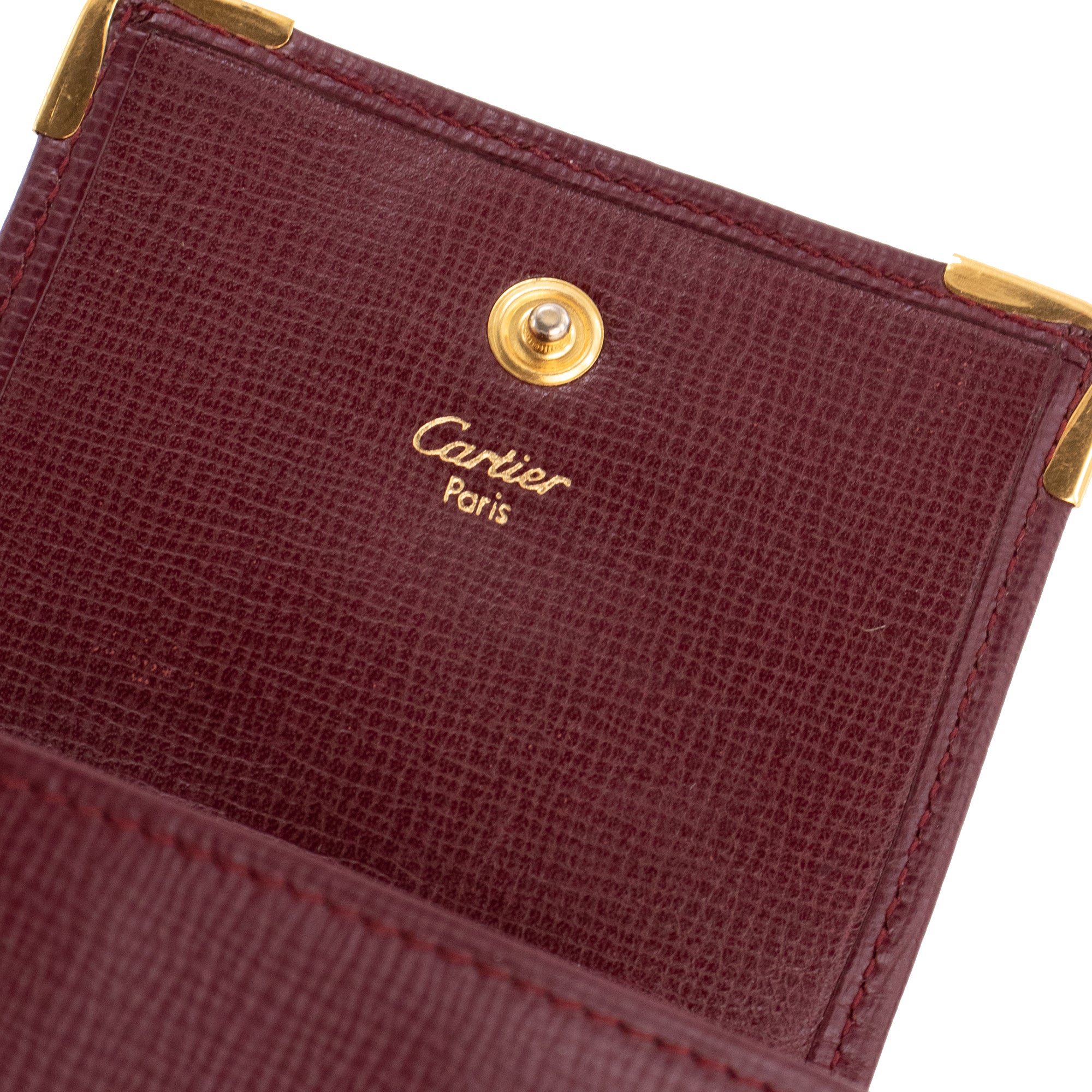 CARTIER - Porte-monnaie Must Cartier en cuir grainé bordeaux
